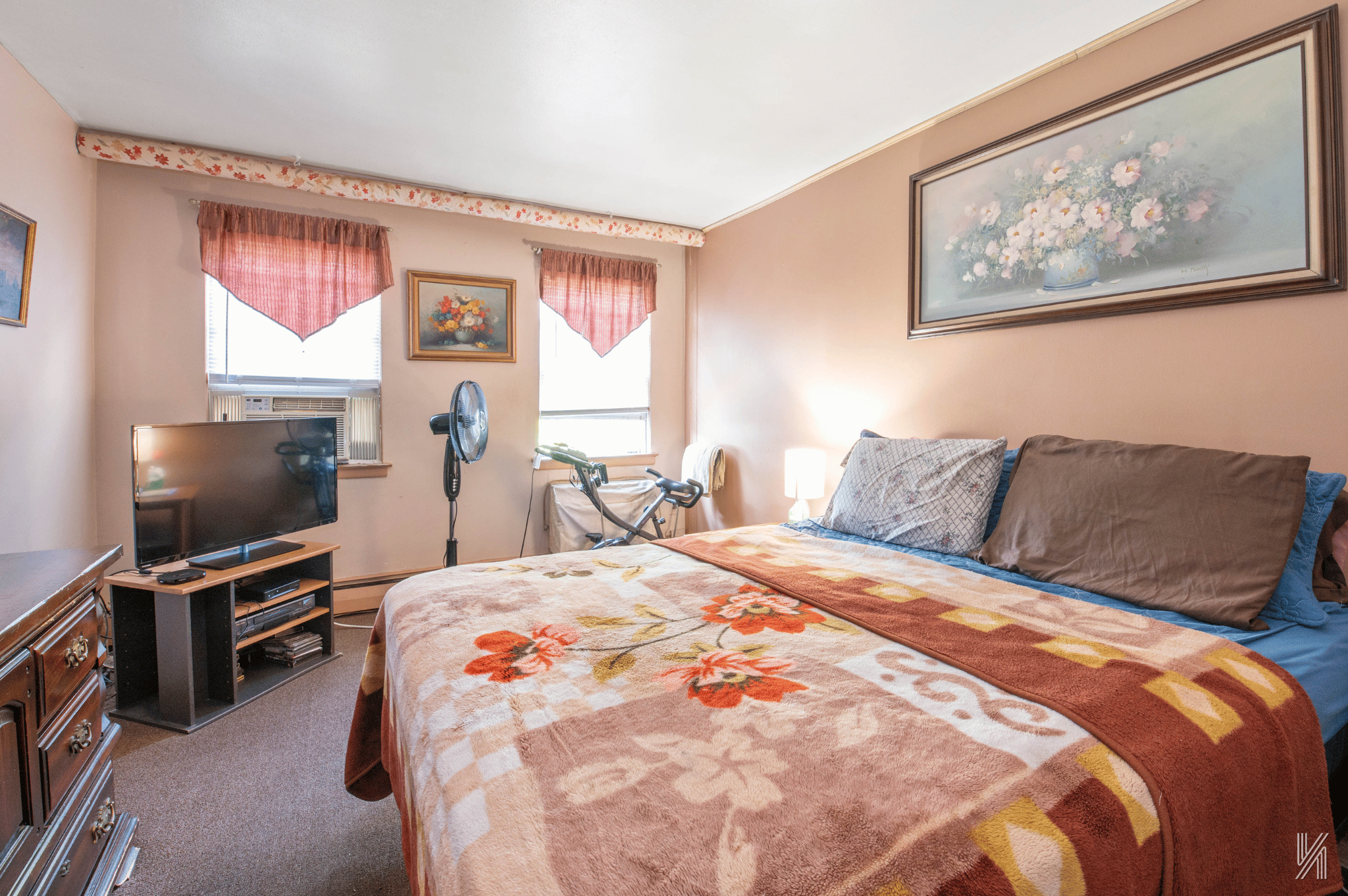 1148 East 73rd Street Brooklyn, NY 11234 - Photo 5 of 15 a bedroom with a bed and a flat screen tv