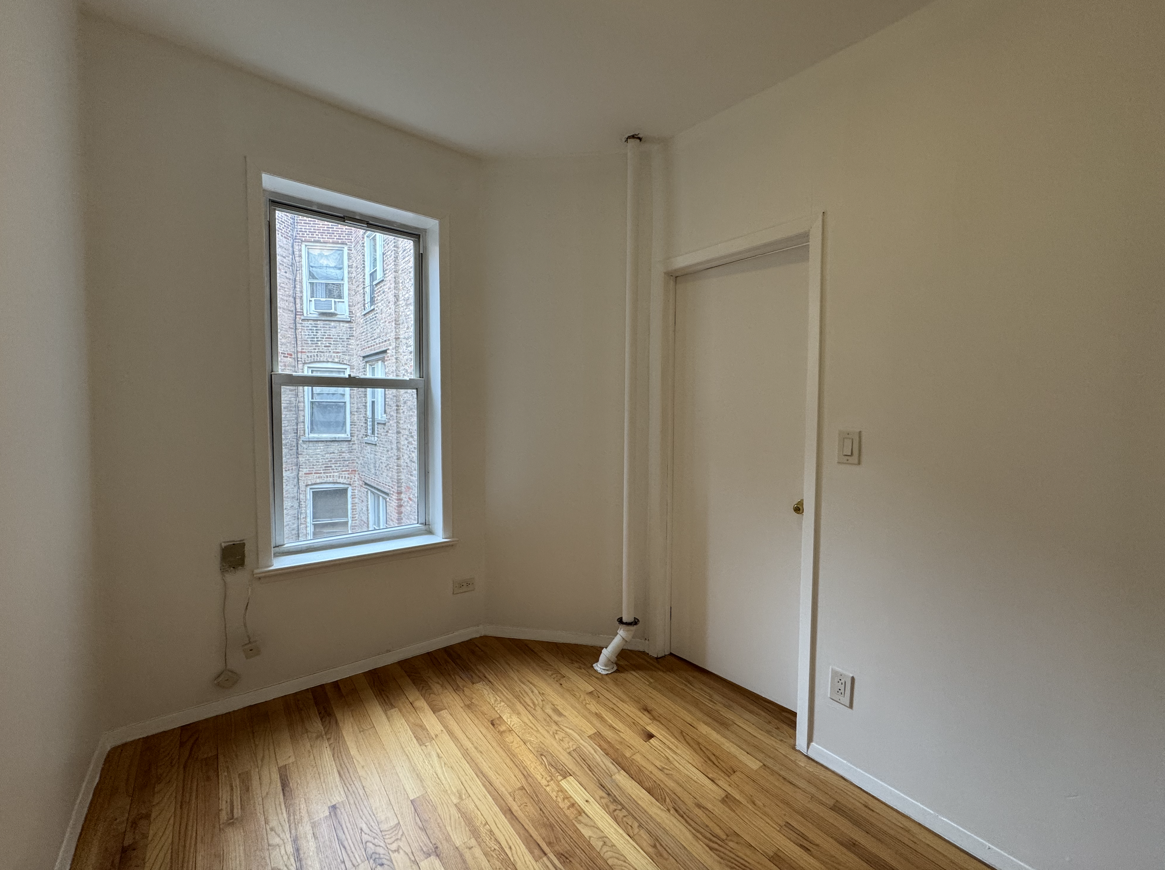451 West 44th Street, Unit 63 Manhattan, NY 10036 - Photo 14 of 31 an empty room with window