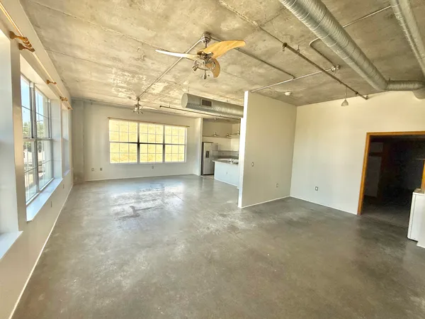 an empty room with windows