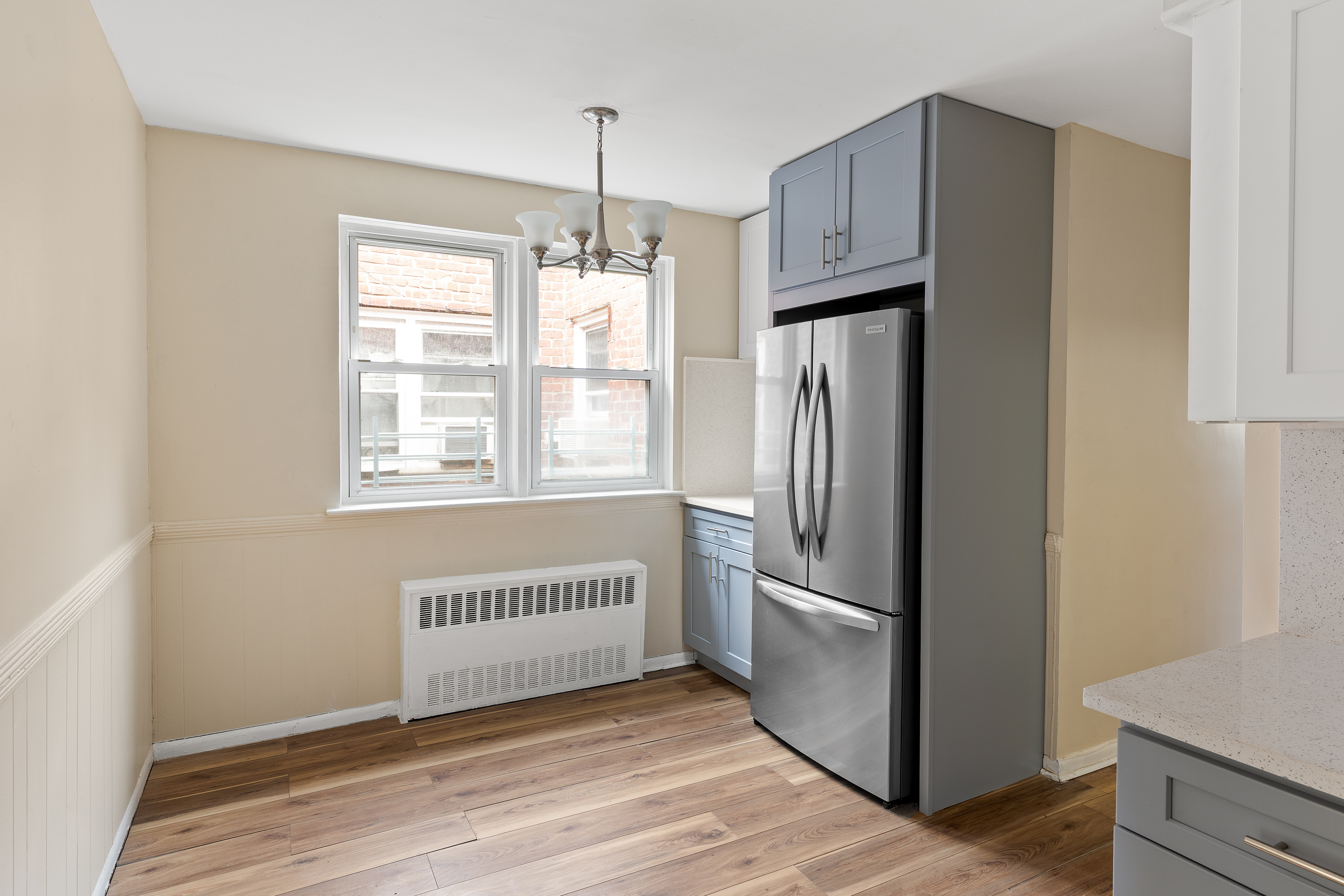 701 Rockaway Parkway, Unit 2F Brooklyn, NY 11236 - Photo 5 of 9 a view of an empty room with a window and wooden floor