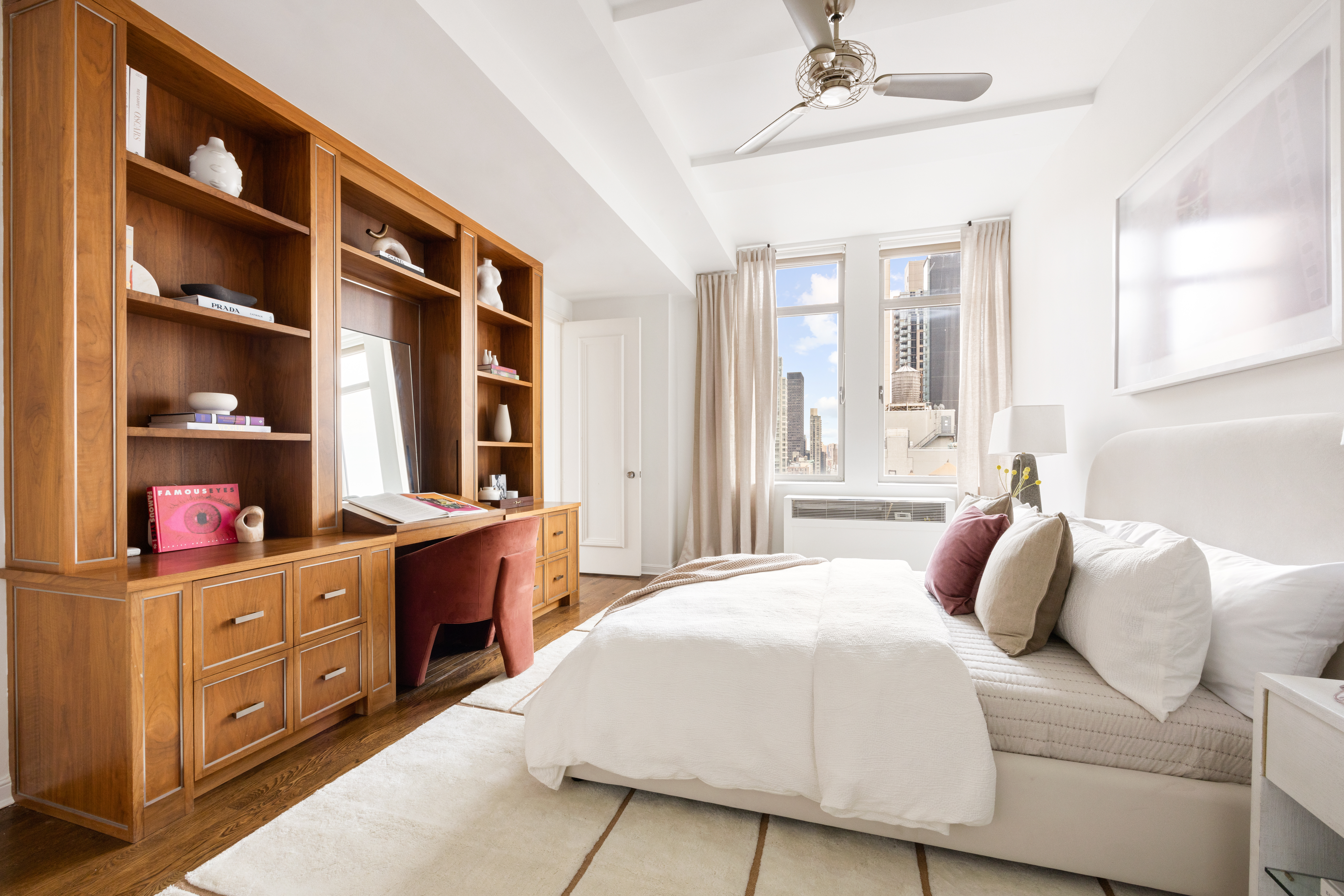 252 7th Avenue, Unit 17I Manhattan, NY 10001 - Photo 13 of 17 a bedroom with a bed and a cabinets
