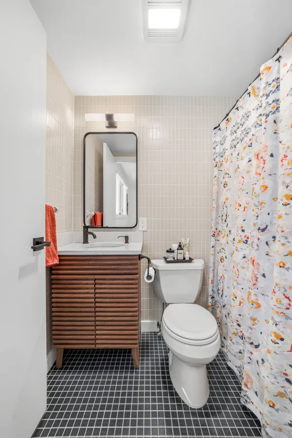 a bathroom with a toilet and a sink