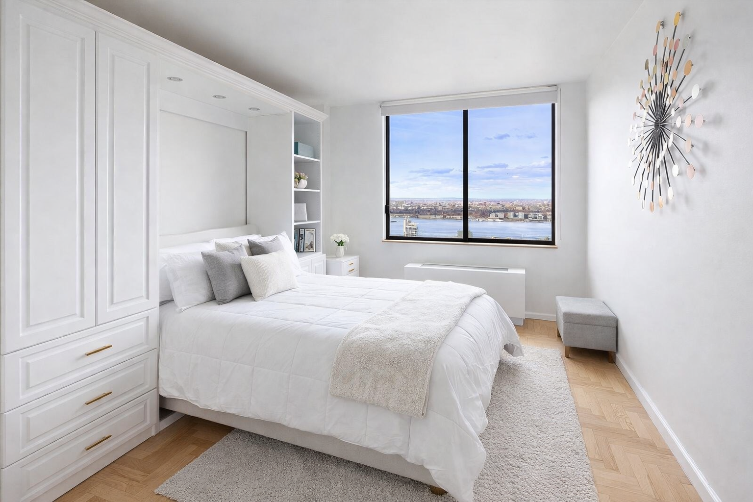 350 West 50th Street, Unit PH3C Manhattan, NY 10019 - Photo 11 of 17 a bedroom with a bed and a window