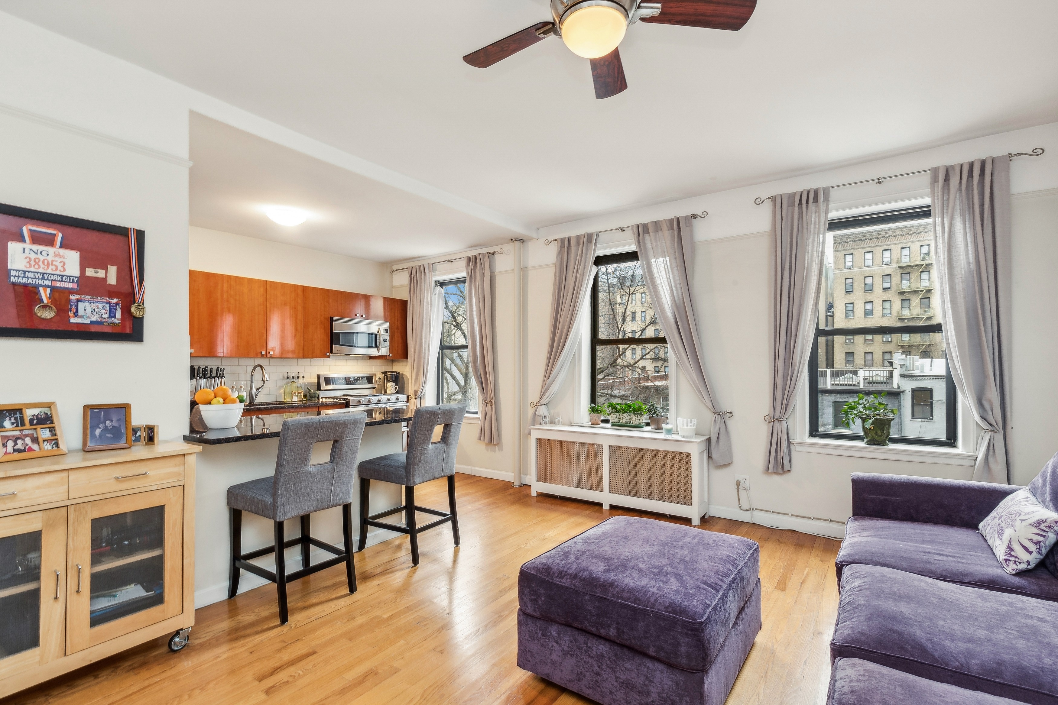 779 Riverside Drive, Unit C31 Manhattan, NY 10032 - Photo 1 of 13 a living room with furniture and a wooden floor