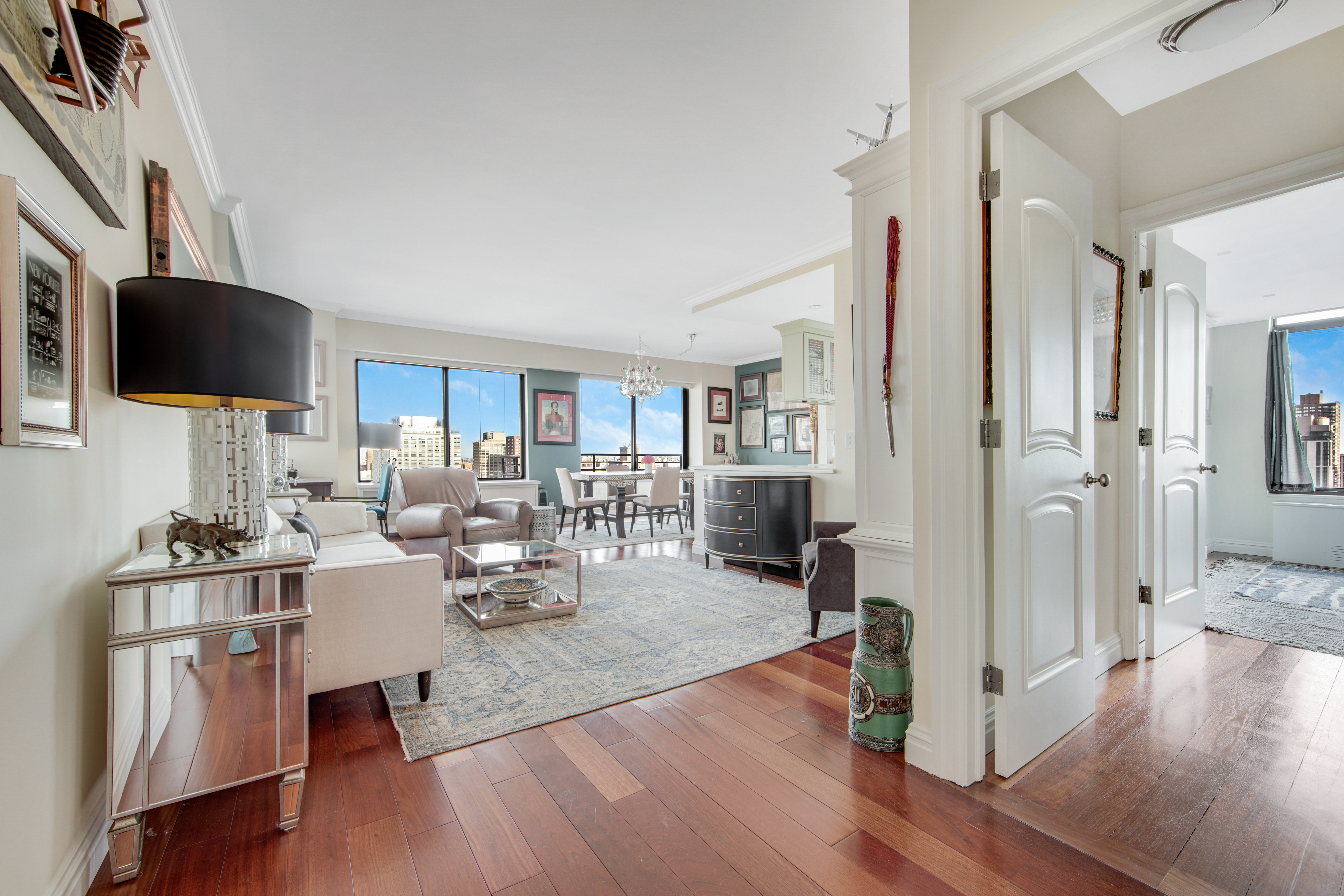 400 East 70th Street, Unit 3301 Manhattan, NY 10021 - Photo 1 of 20 a living room with furniture or wooden floor and a flat screen tv