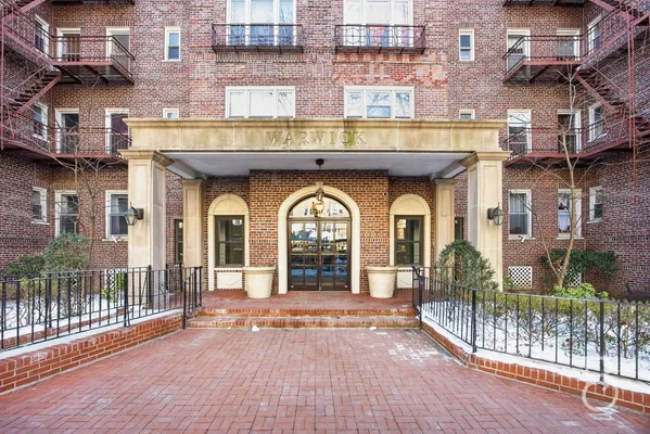 an entrance to building with a garden