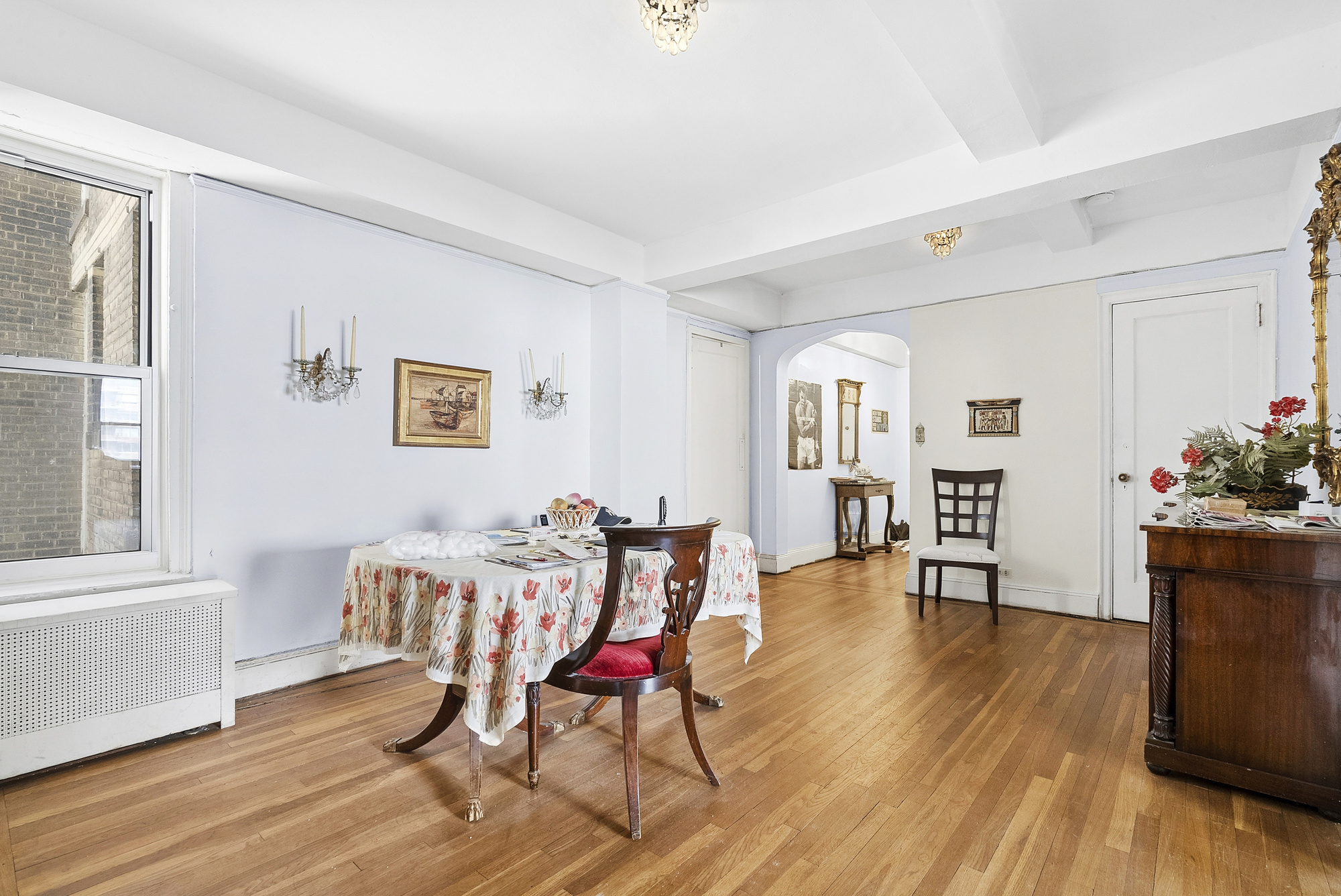12 West 96th Street, Unit 9A Manhattan, NY 10025 - Photo 5 of 14 a view of a livingroom with furniture and wooden floor