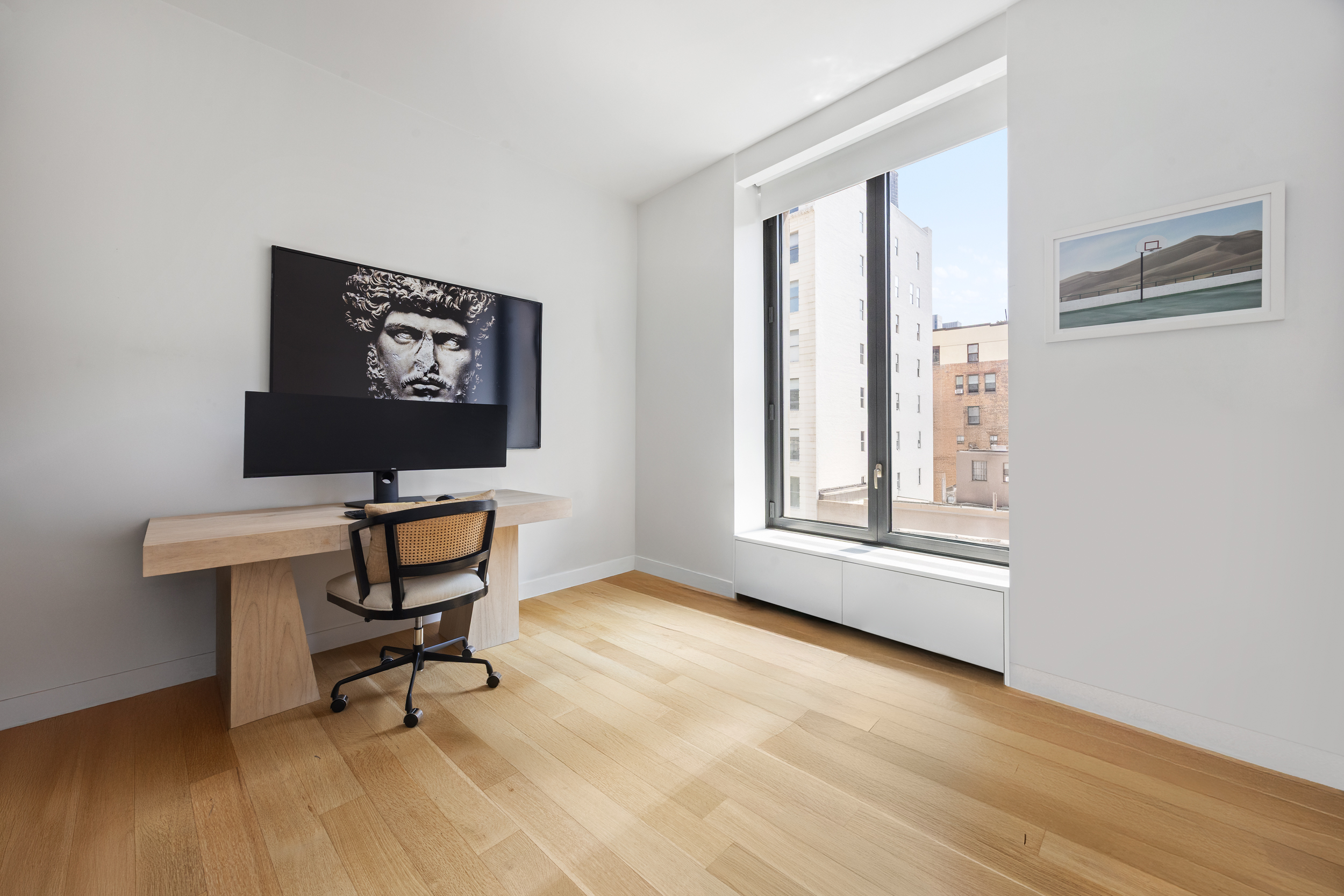 21 East 12th Street, Unit 8A Manhattan, NY 10003 - Photo 11 of 20 a view of a workspace with furniture and a window