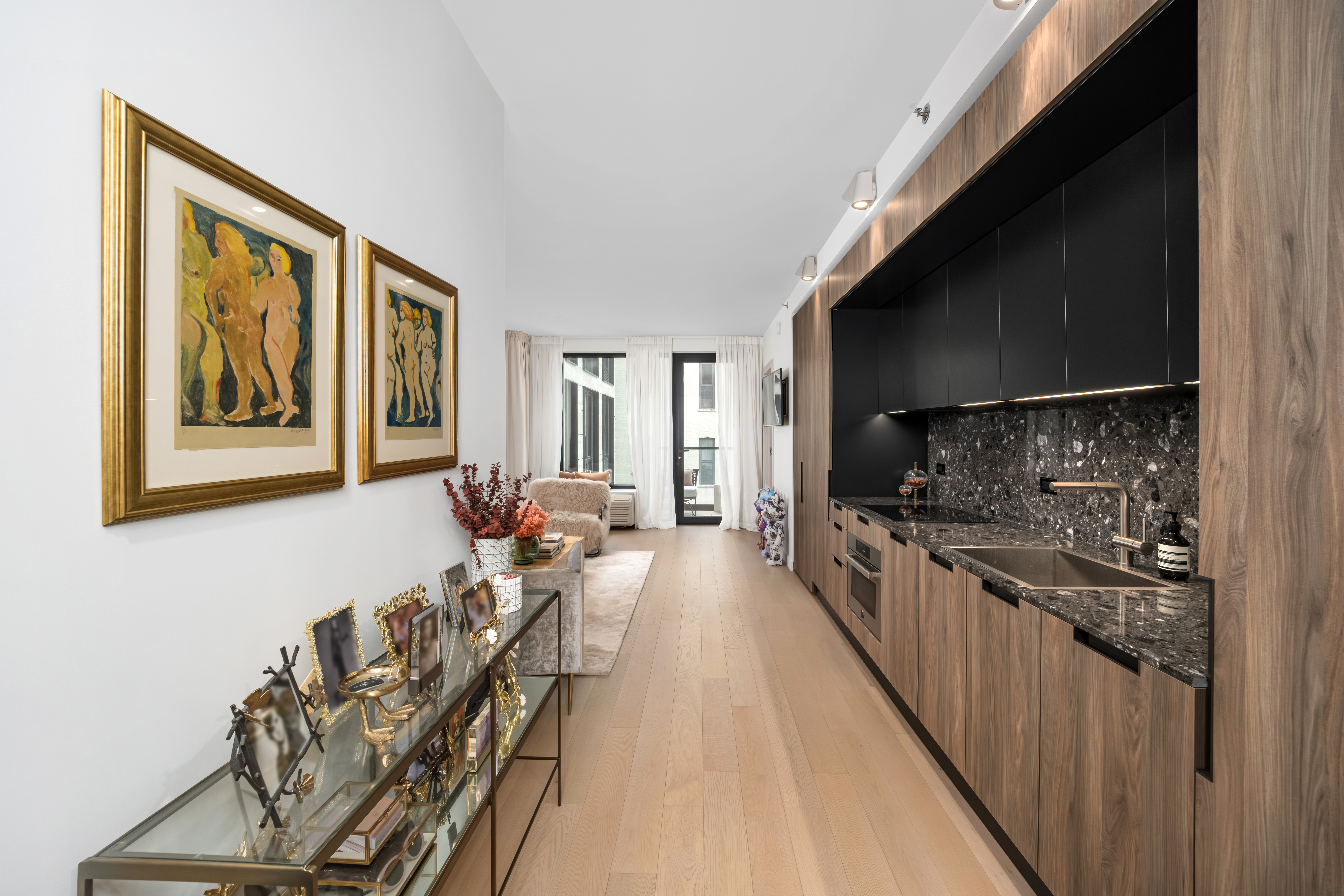 181 East 101st Street, Unit 701 Manhattan, NY 10029 - Photo 5 of 16 a large living room with stainless steel appliances granite countertop lots of wooden furniture