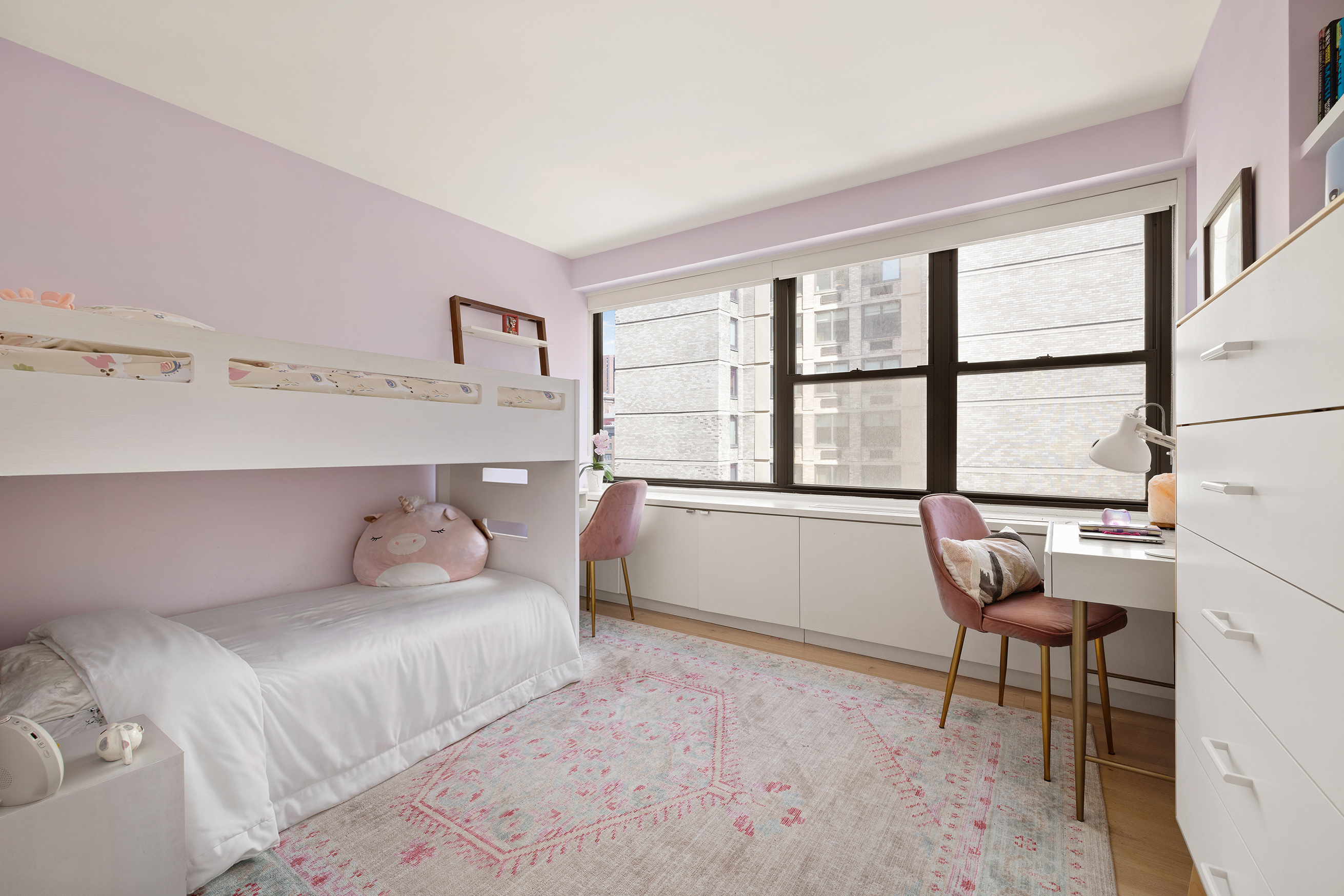 1065 Park Avenue, Unit 10CD Manhattan, NY 10128 - Photo 6 of 10 a bedroom with a bed and a chair