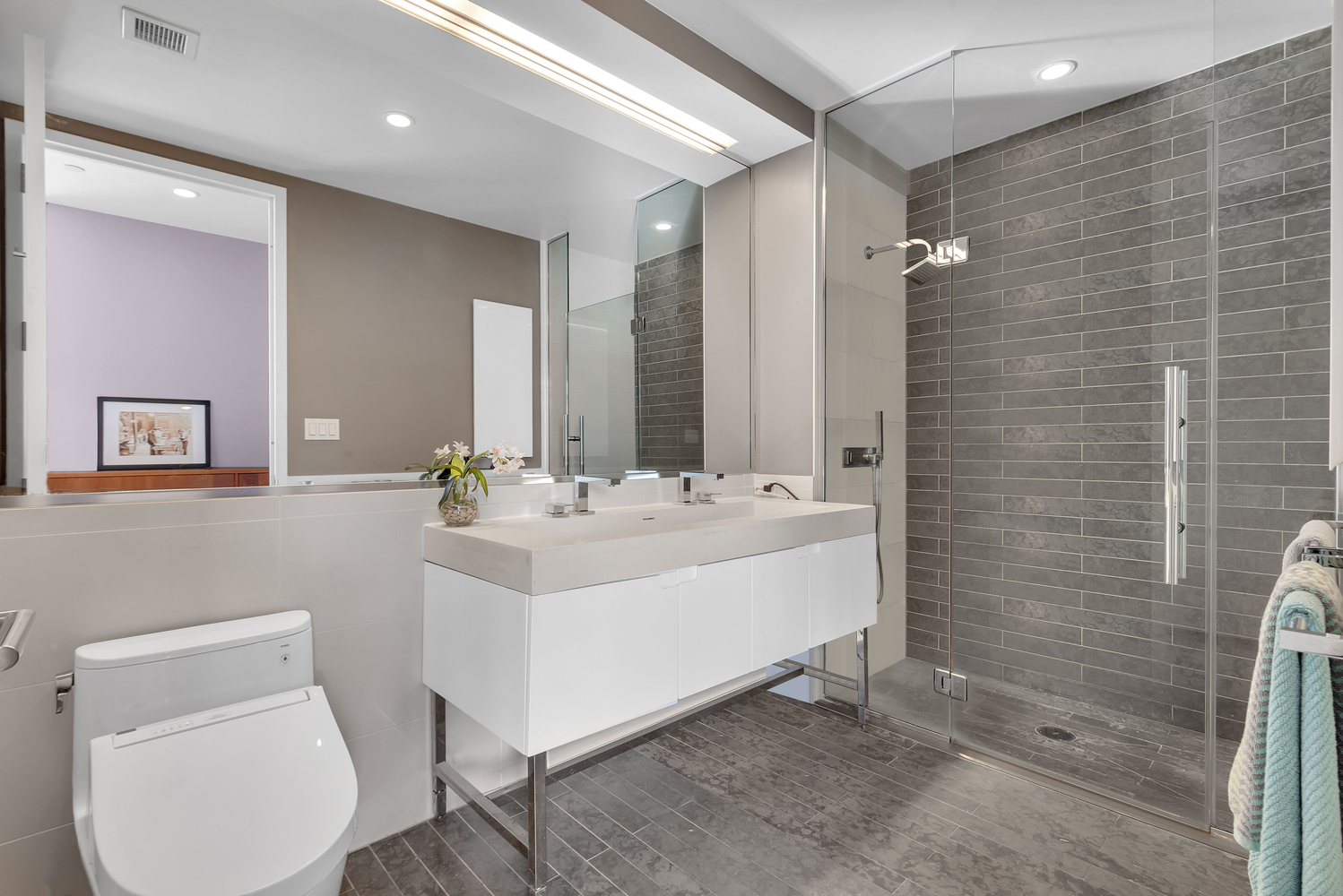 388 Bridge Street, Unit PH50D Brooklyn, NY 11201 - Photo 12 of 29 a bathroom with a sink mirror and toilet