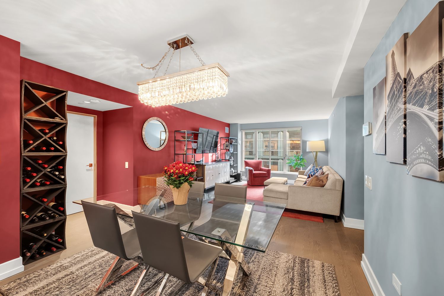 a living room with furniture and a chandelier
