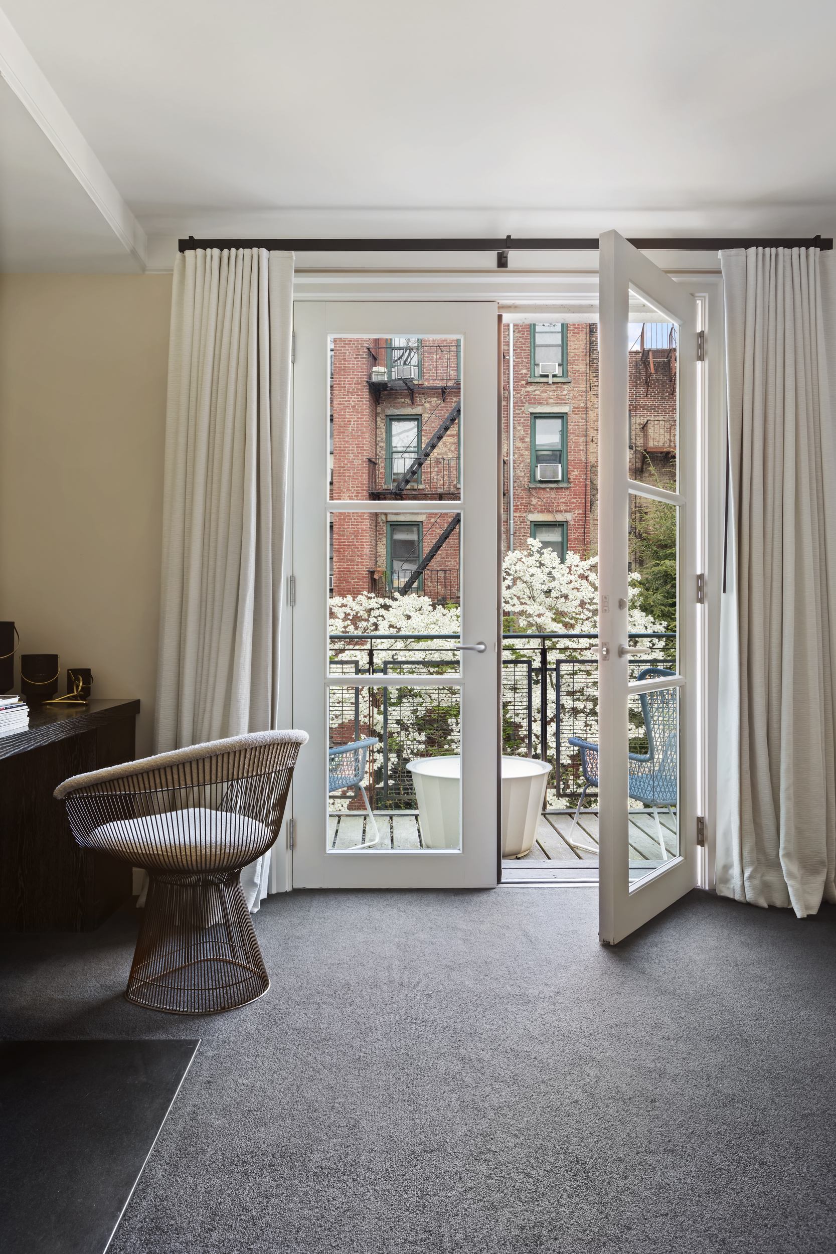 83 Jane Street Manhattan, NY 10014 - Photo 15 of 29 a view of a livingroom with furniture and a large window