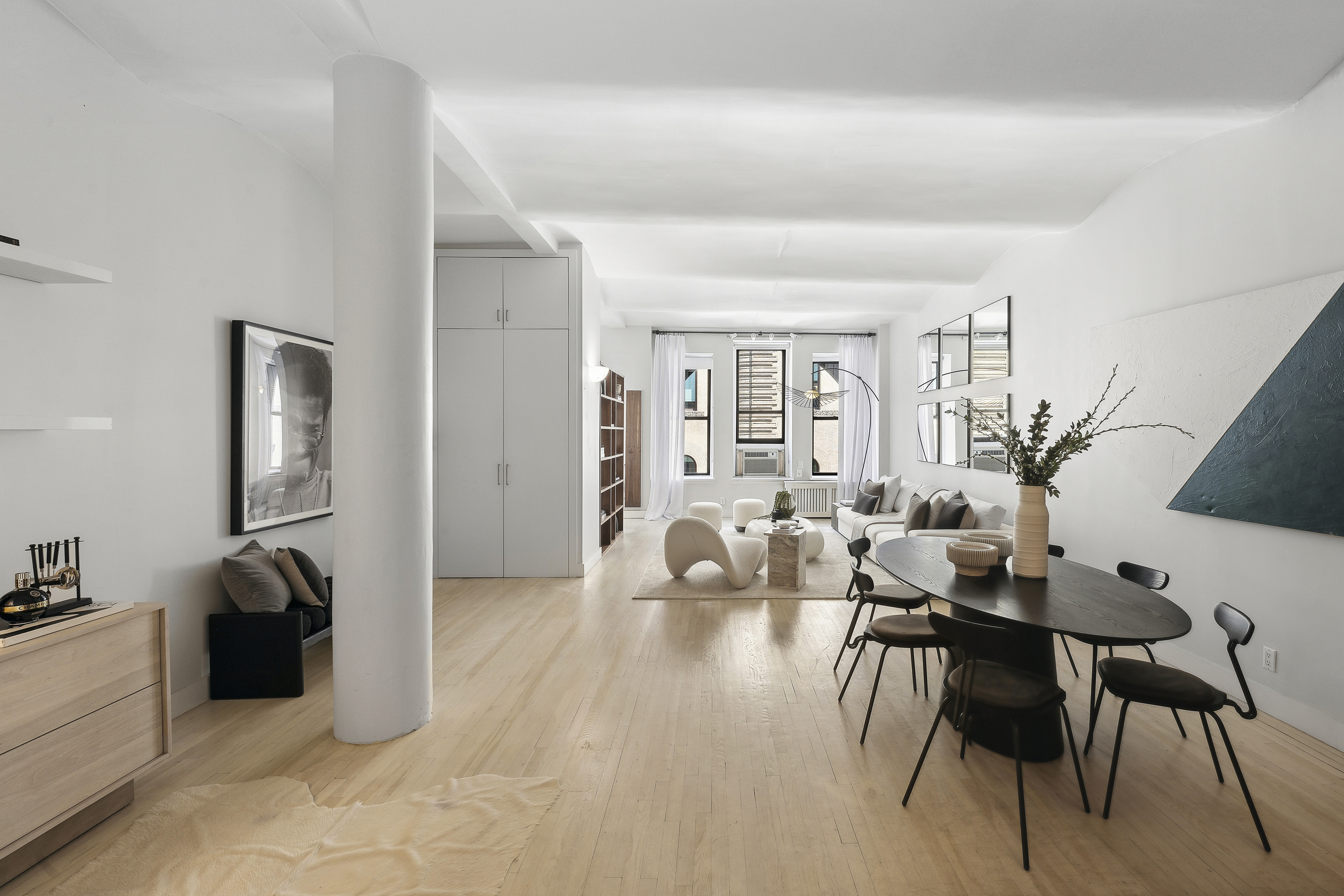 4 West 16th Street, Unit 4A Manhattan, NY 10011 - Photo 4 of 11 a view of a livingroom with furniture and a flat screen tv