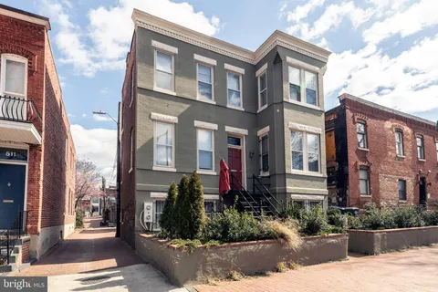 a front view of a multi story residential apartment building