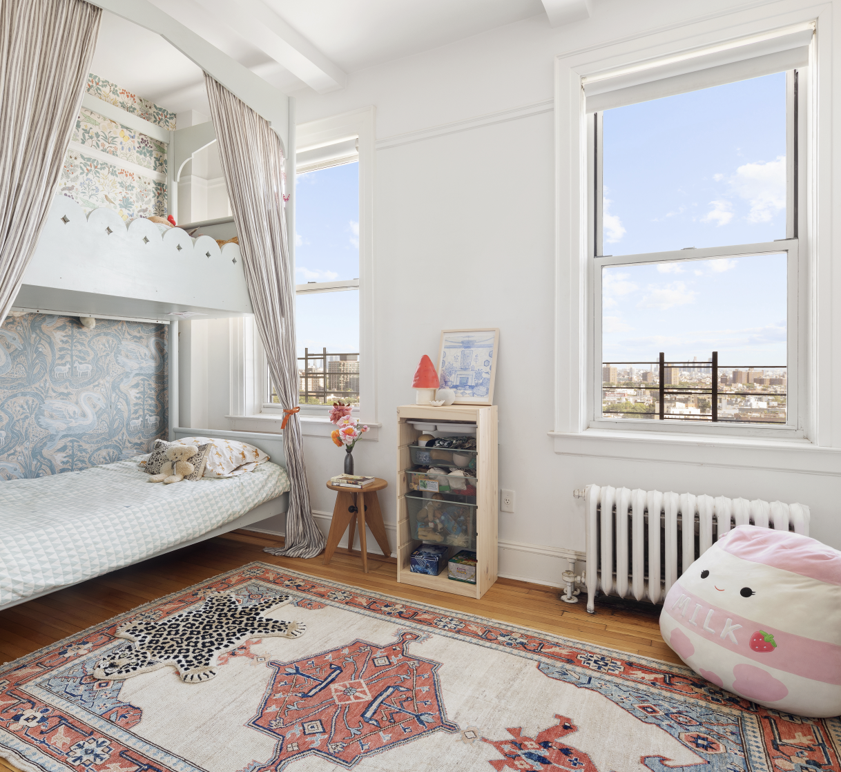 41 Eastern Parkway, Unit 11E Brooklyn, NY 11238 - Photo 9 of 14 a living room with furniture and a large window