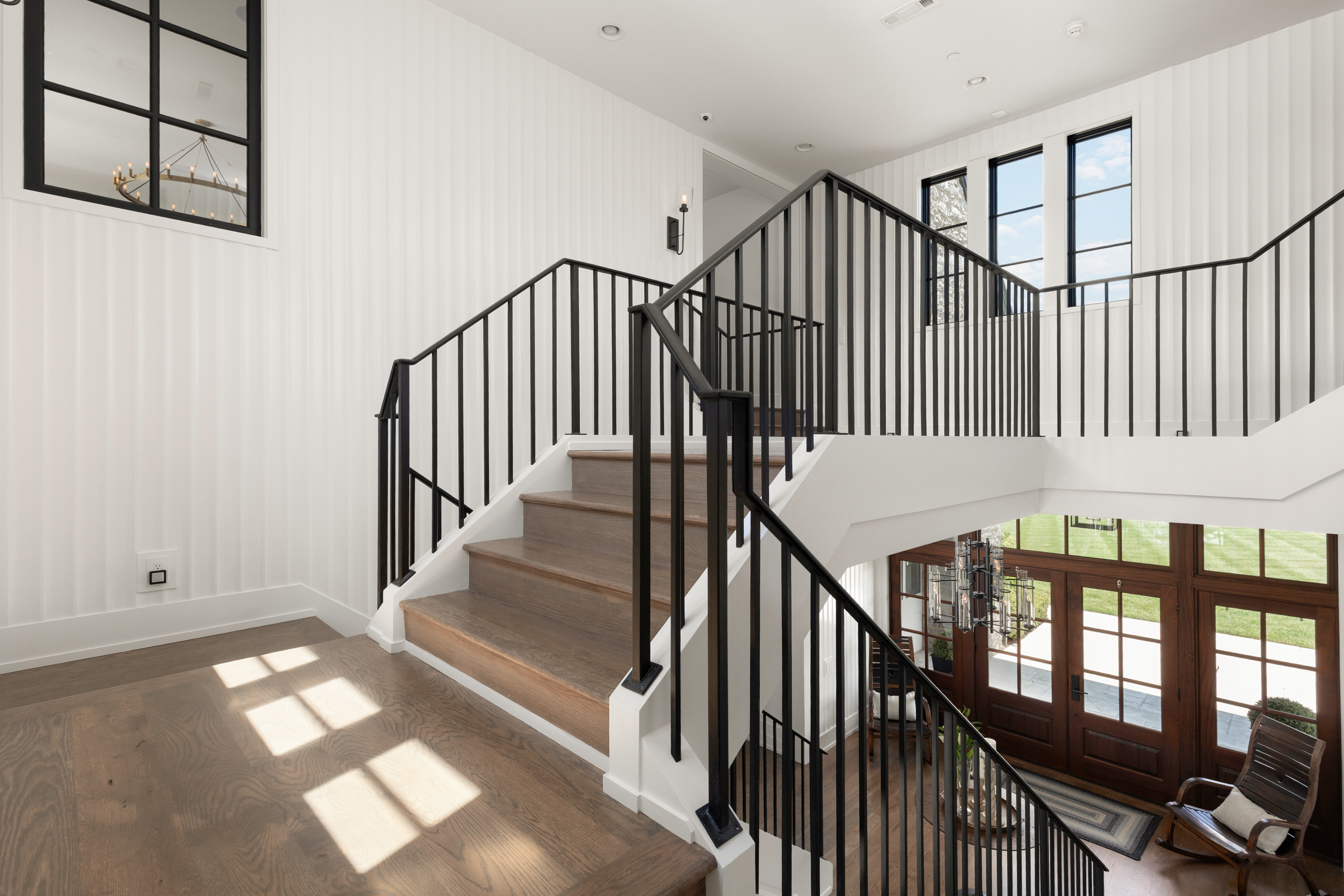 5747 Garrison Road Franklin, TN 37064 - Photo 33 of 47 a view of staircase with lots of frames on wall and a window