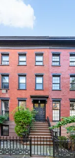 a front view of a building with balcony