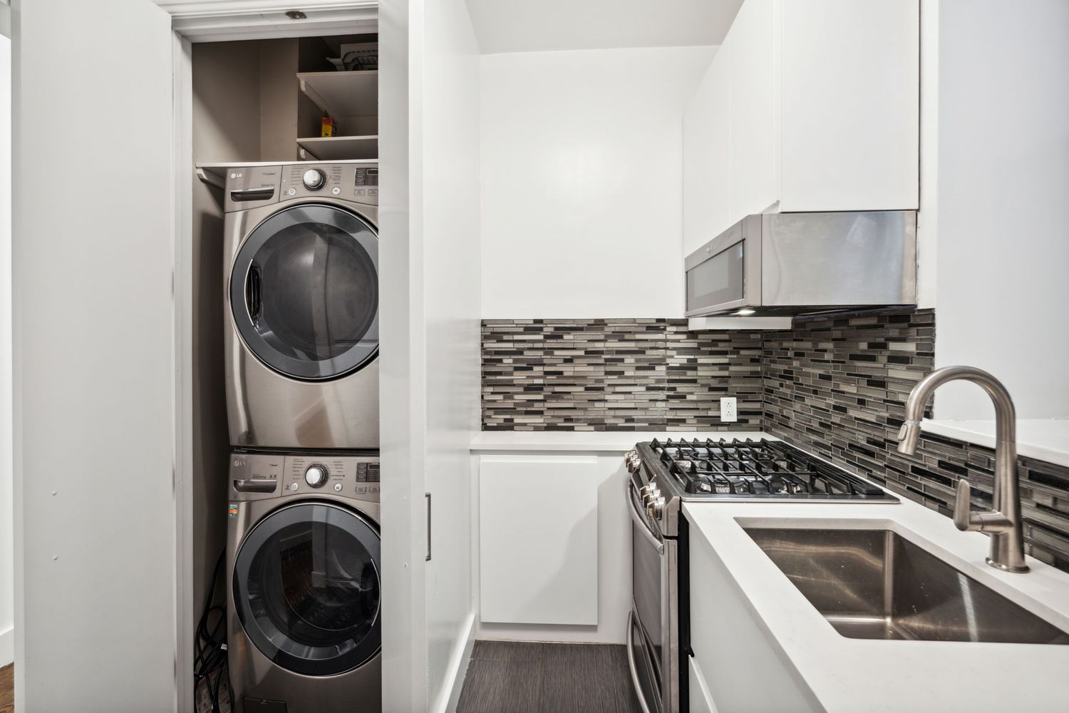 a view of a kitchen with washer and dryer