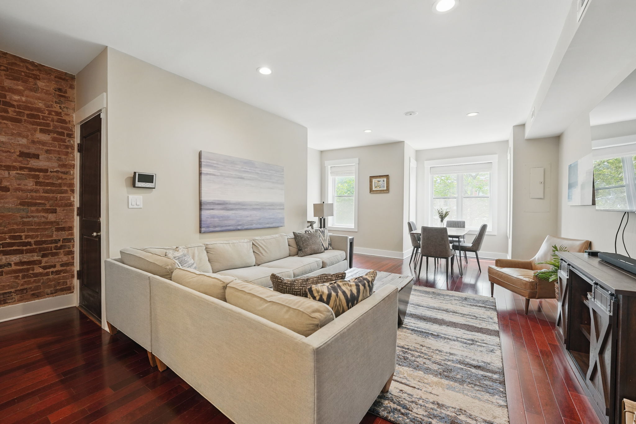 28 Q Street Northeast, Unit 2 Washington, DC 20002 - Photo 7 of 41 a living room with furniture and wooden floor