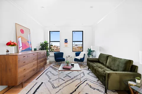 a living room with furniture and a couch