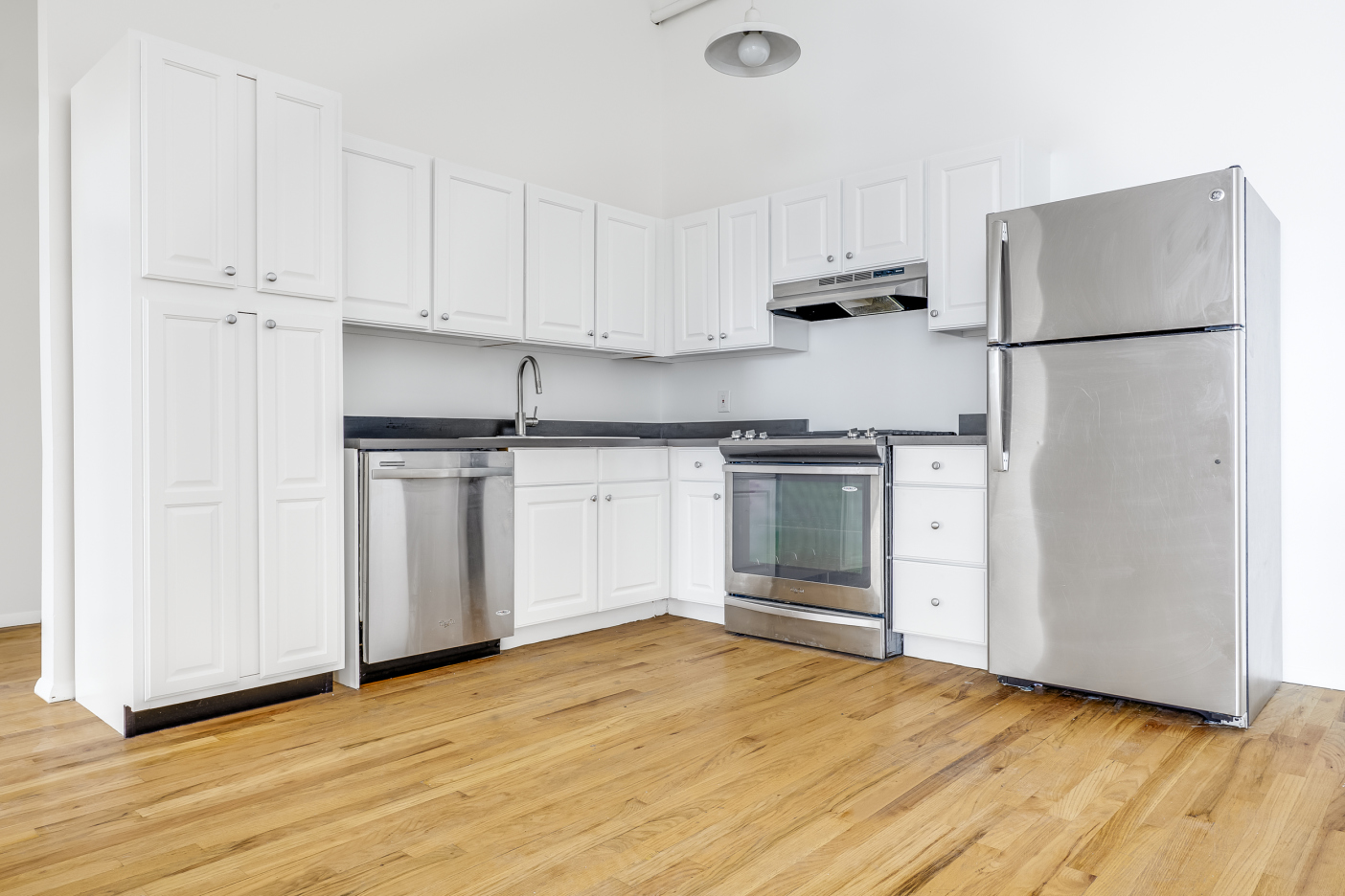 204 Huntington Street, Unit 3E Brooklyn, NY 11231 - Photo 1 of 13 a kitchen with stainless steel appliances granite countertop a refrigerator sink and white cabinets