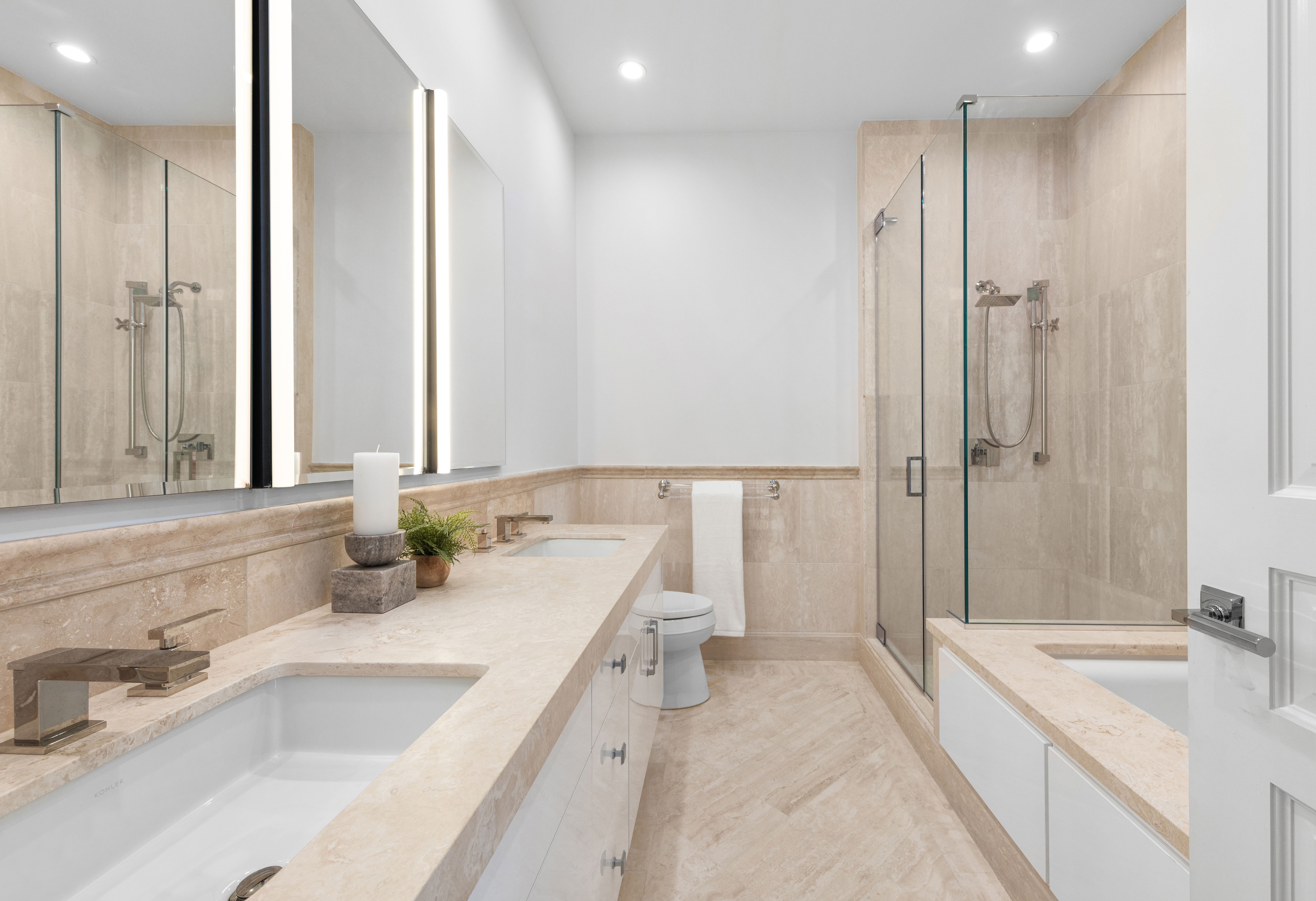 351 East 51st Street, Unit L5C Manhattan, NY 10022 - Photo 6 of 18 a bathroom with a tub sink and mirror