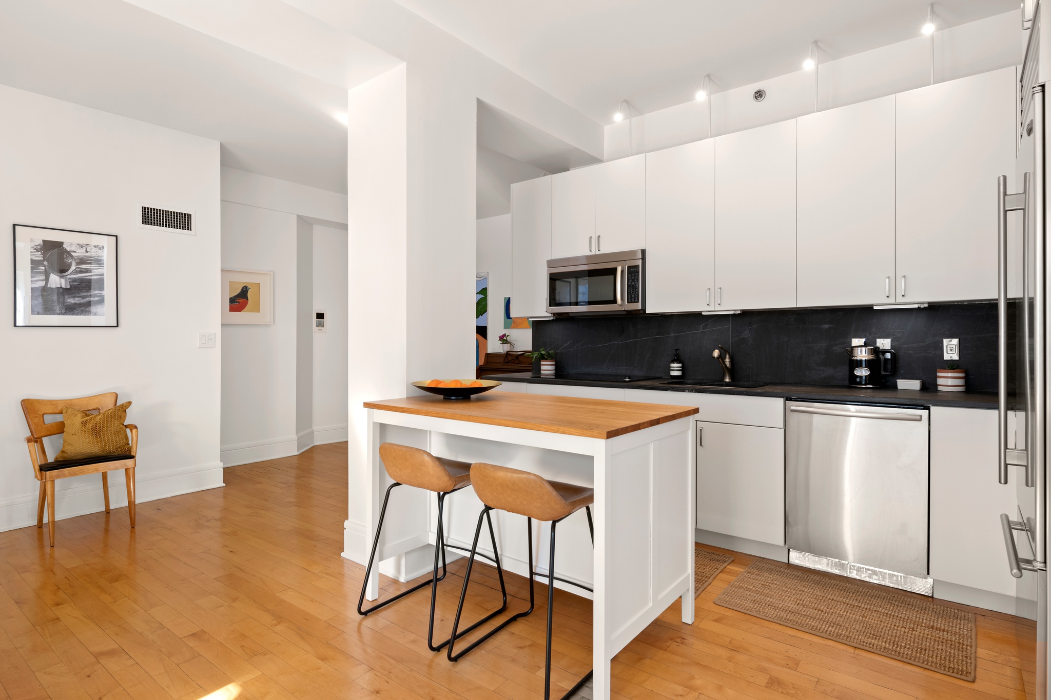 57 Front Street, Unit 303 Brooklyn, NY 11201 - Photo 6 of 15 a kitchen with stainless steel appliances a stove a sink a microwave a refrigerator and cabinets