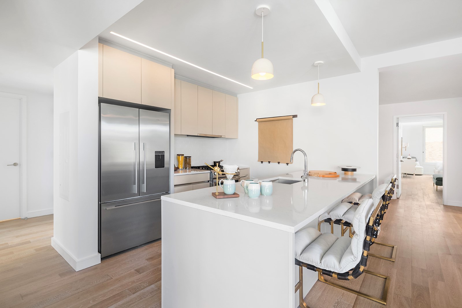 146 Pierrepont Street, Unit 2C Brooklyn, NY 11201 - Photo 3 of 30 a kitchen with refrigerator a sink dishwasher a dining table and chairs with wooden floor