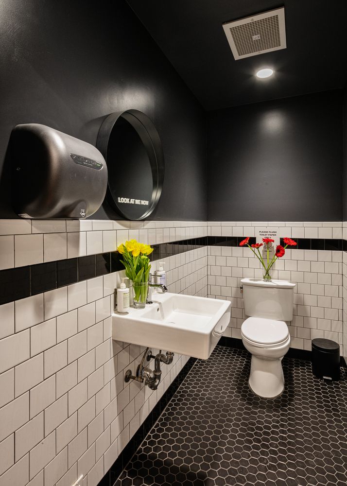 57 Leonard Street, Unit 1FLR/BASEMENT Manhattan, NY 10013 - Photo 9 of 12 a bathroom with a toilet sink and mirror