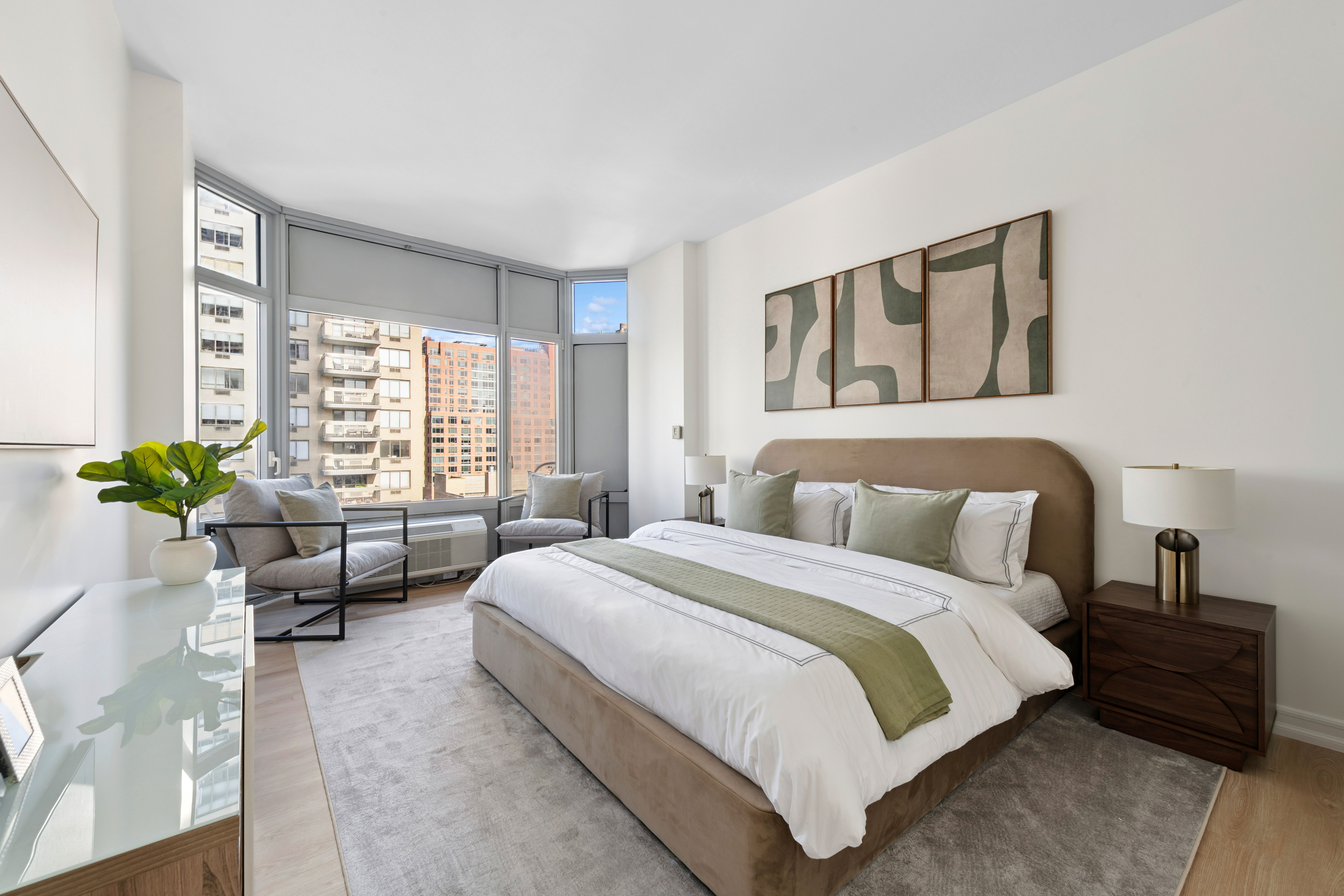 200 East 32nd Street, Unit 11D Manhattan, NY 10016 - Photo 10 of 19 a bedroom with bed and a couch