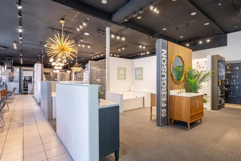 a lobby with furniture and a potted plant