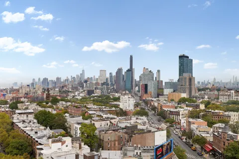 a view of a city with tall buildings