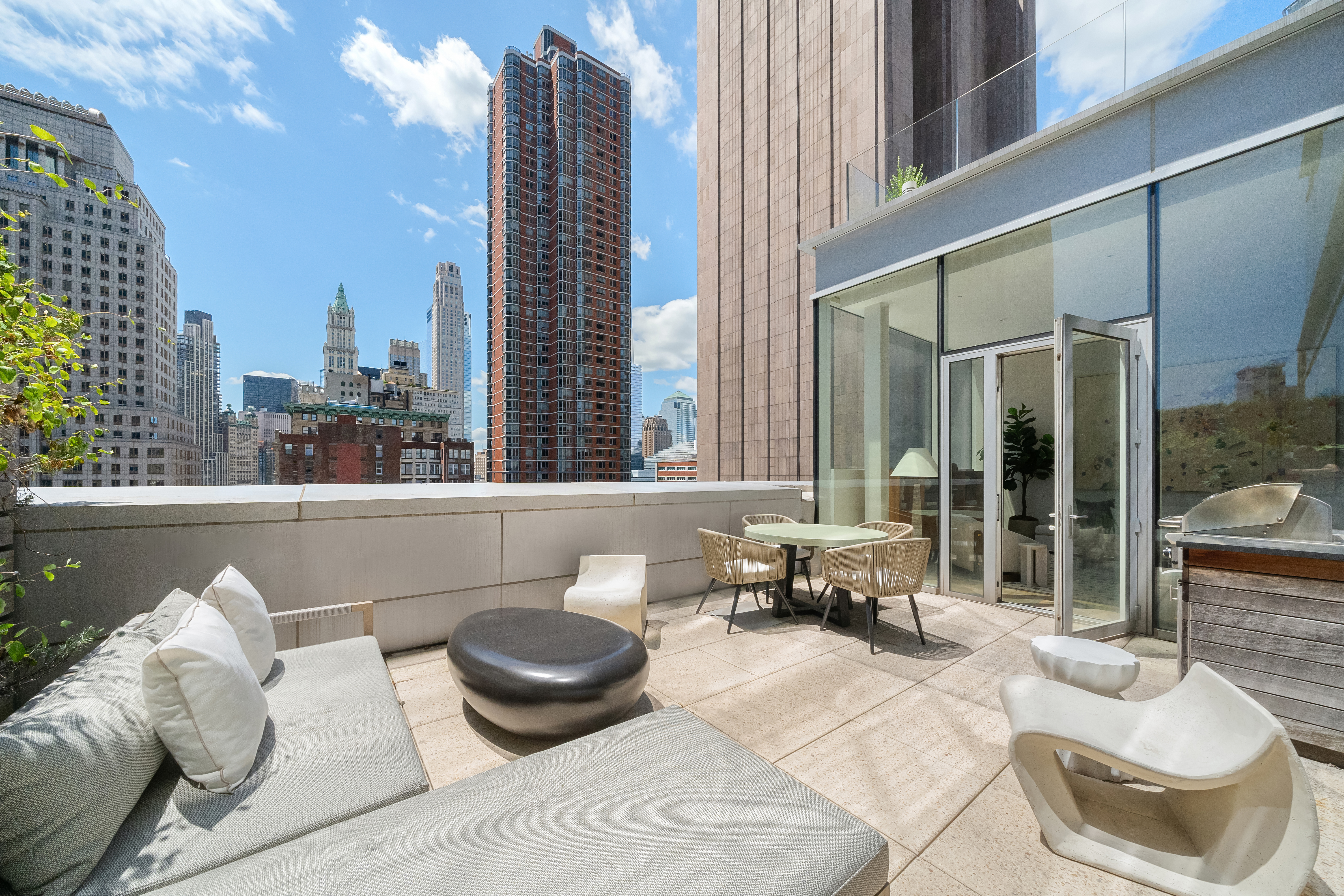 93 Worth Street, Unit PH5 Manhattan, NY 10013 - Photo 4 of 19 a living room with furniture and a large window