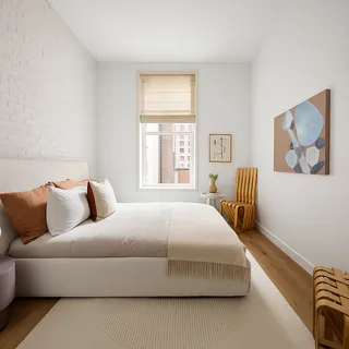 a bedroom with a bed and a couch