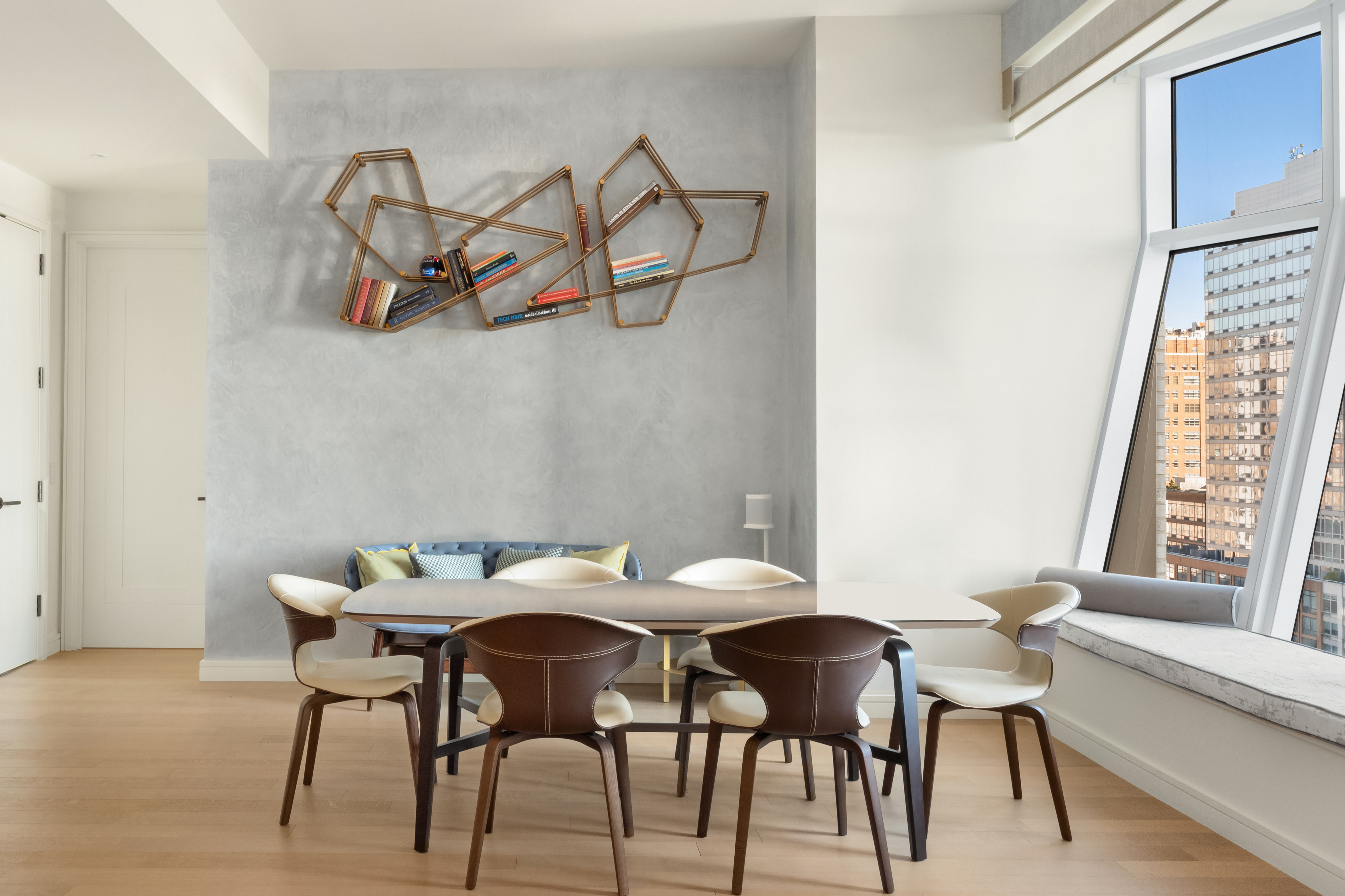 515 West 18th Street, Unit 1403 Manhattan, NY 10011 - Photo 5 of 21 a view of a dining room that has a table and chairs in it