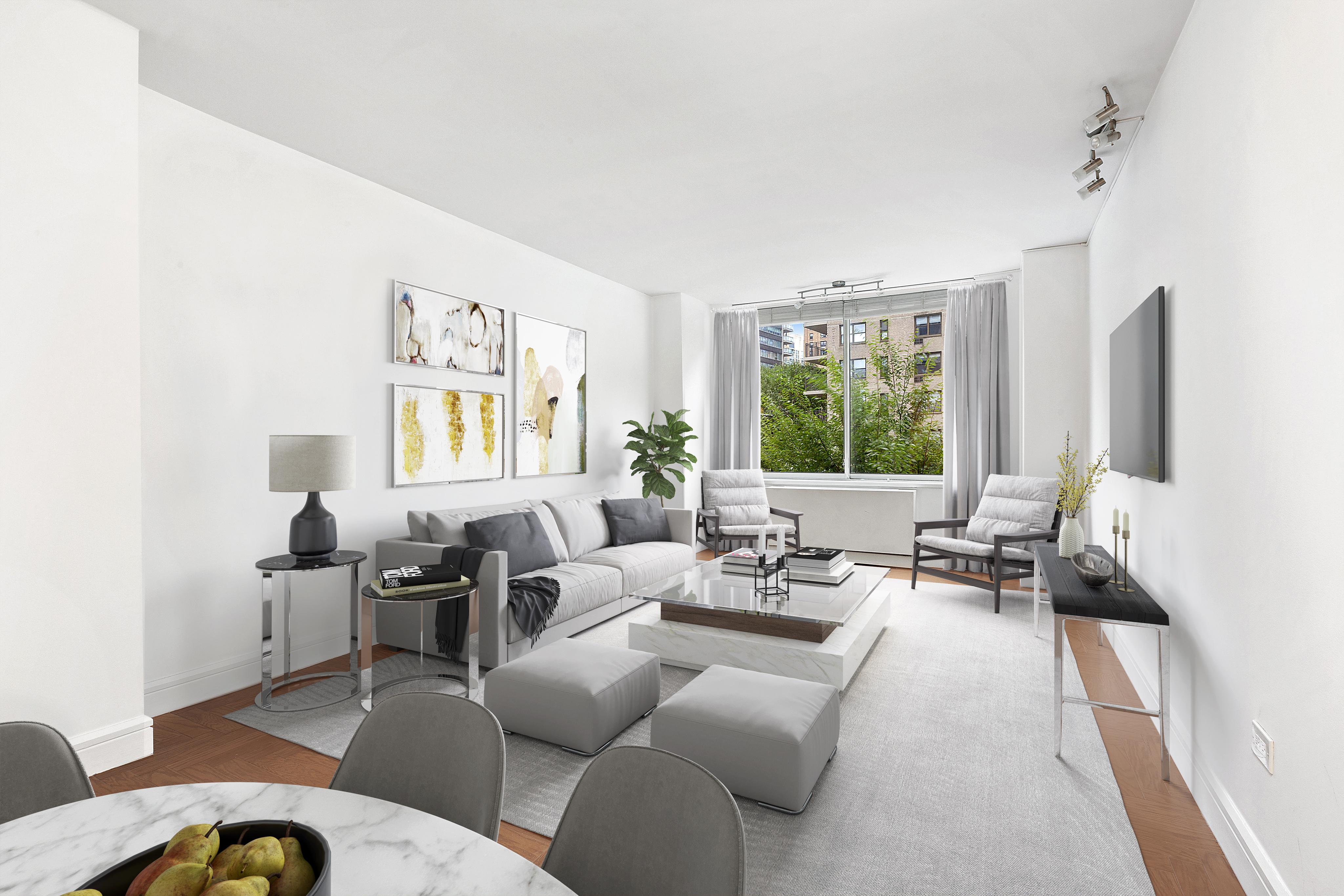 a living room with furniture fireplace and a large window