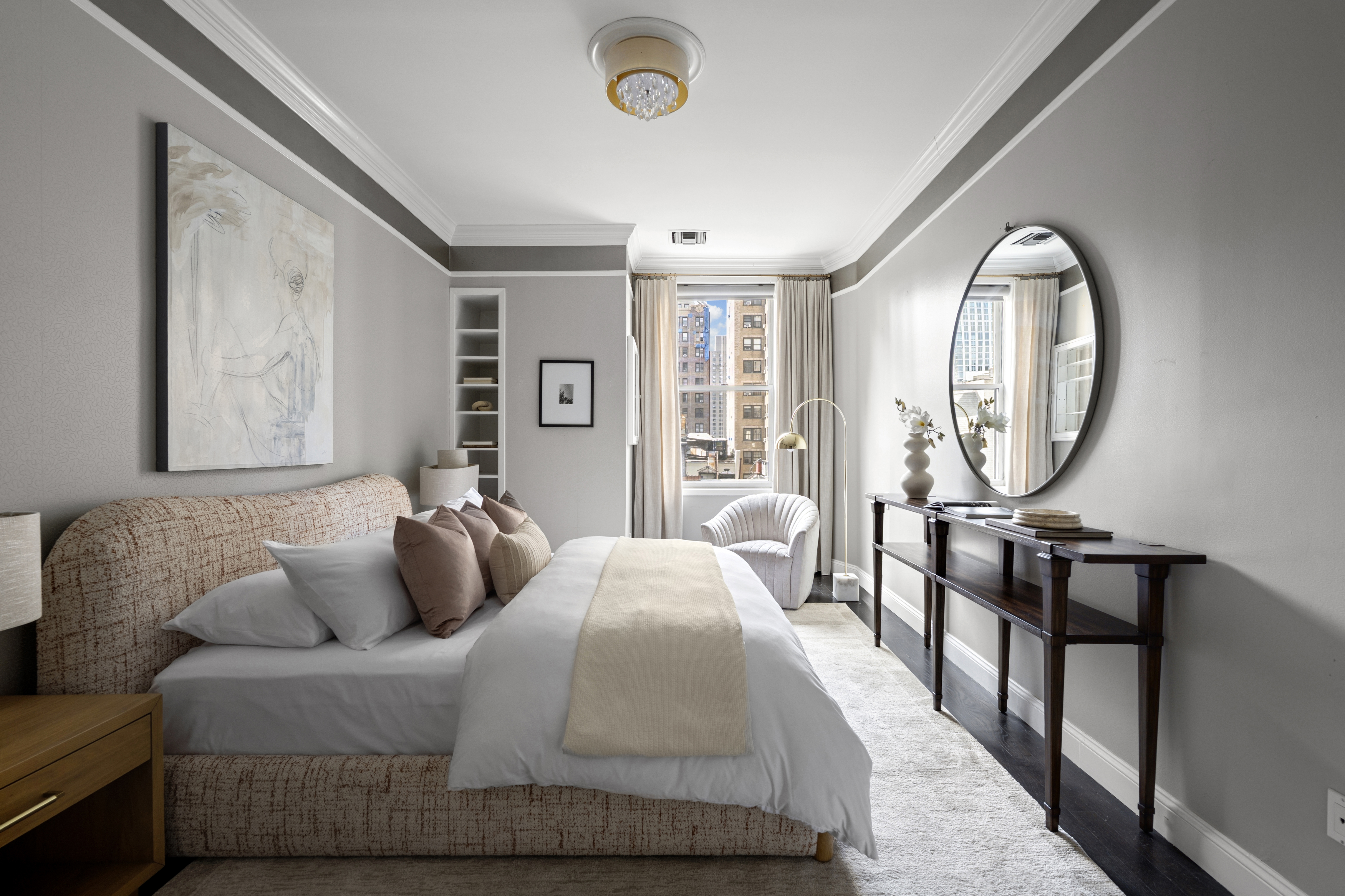 253 West 73rd Street, Unit 6B-C Manhattan, NY 10023 - Photo 10 of 21 a living room with furniture and a large window