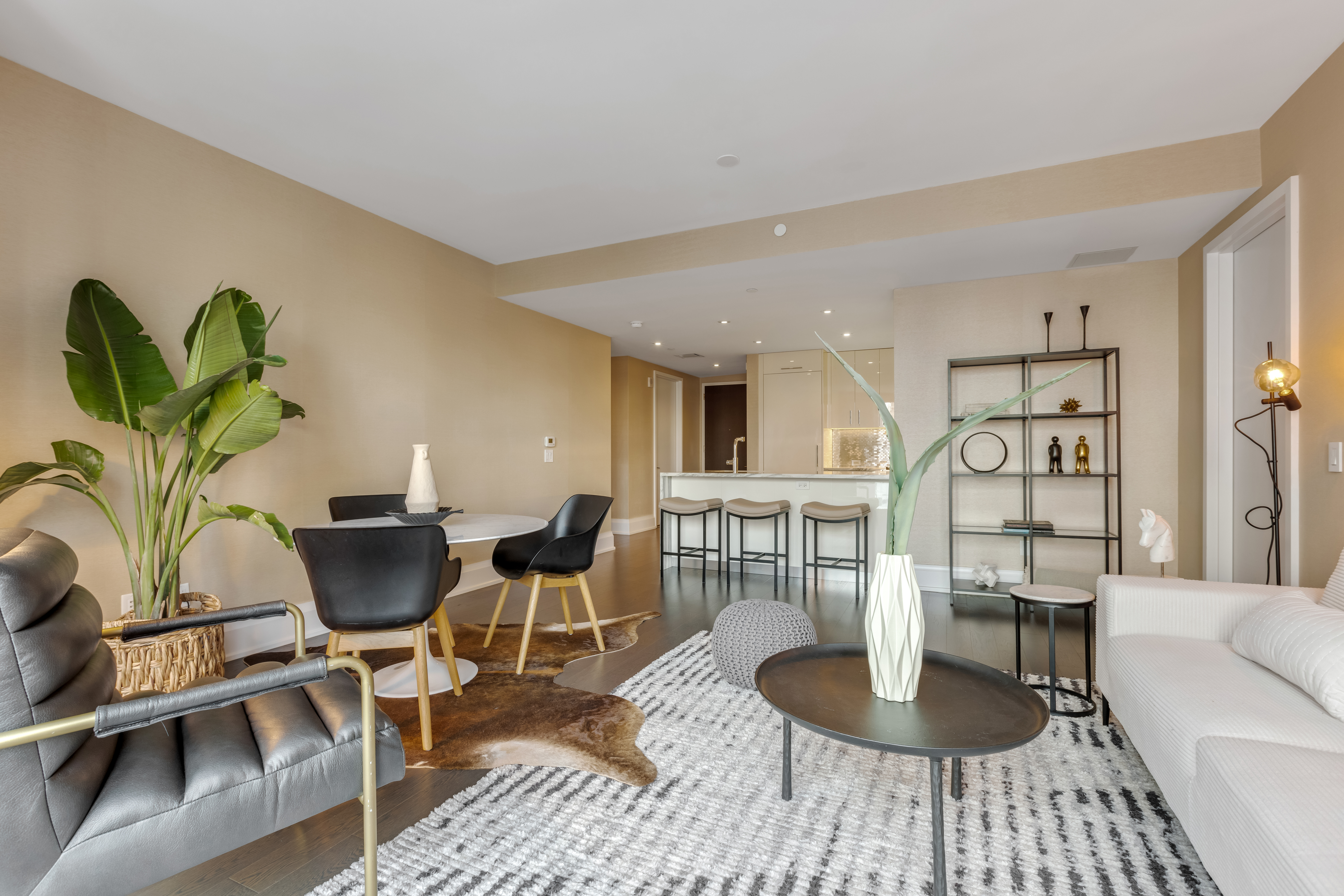 50 Riverside Boulevard, Unit 19F Manhattan, NY 10069 - Photo 3 of 24 a living room with furniture a wooden floor and a table