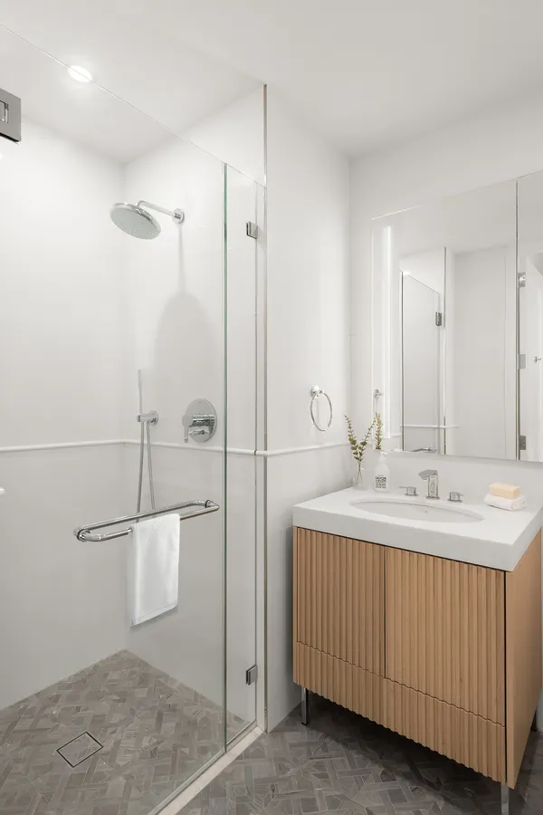 a bathroom with a double vanity sink and mirror