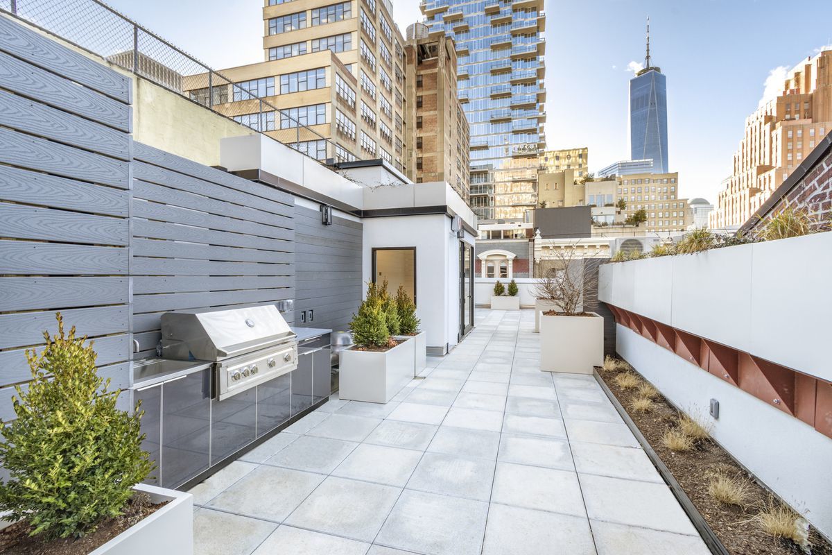 106 Franklin Street, Unit PH Manhattan, NY 10013 - Photo 11 of 13 a view of a patio with couches and potted plants