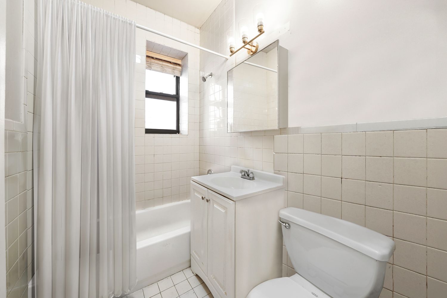 a bathroom with a toilet sink and bathtub