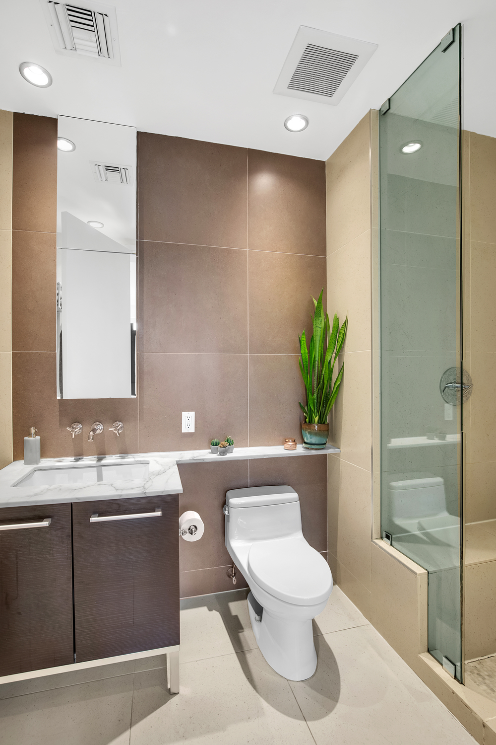 309 2nd Street, Unit 3E Brooklyn, NY 11215 - Photo 8 of 11 a bathroom with a sink a toilet and shower