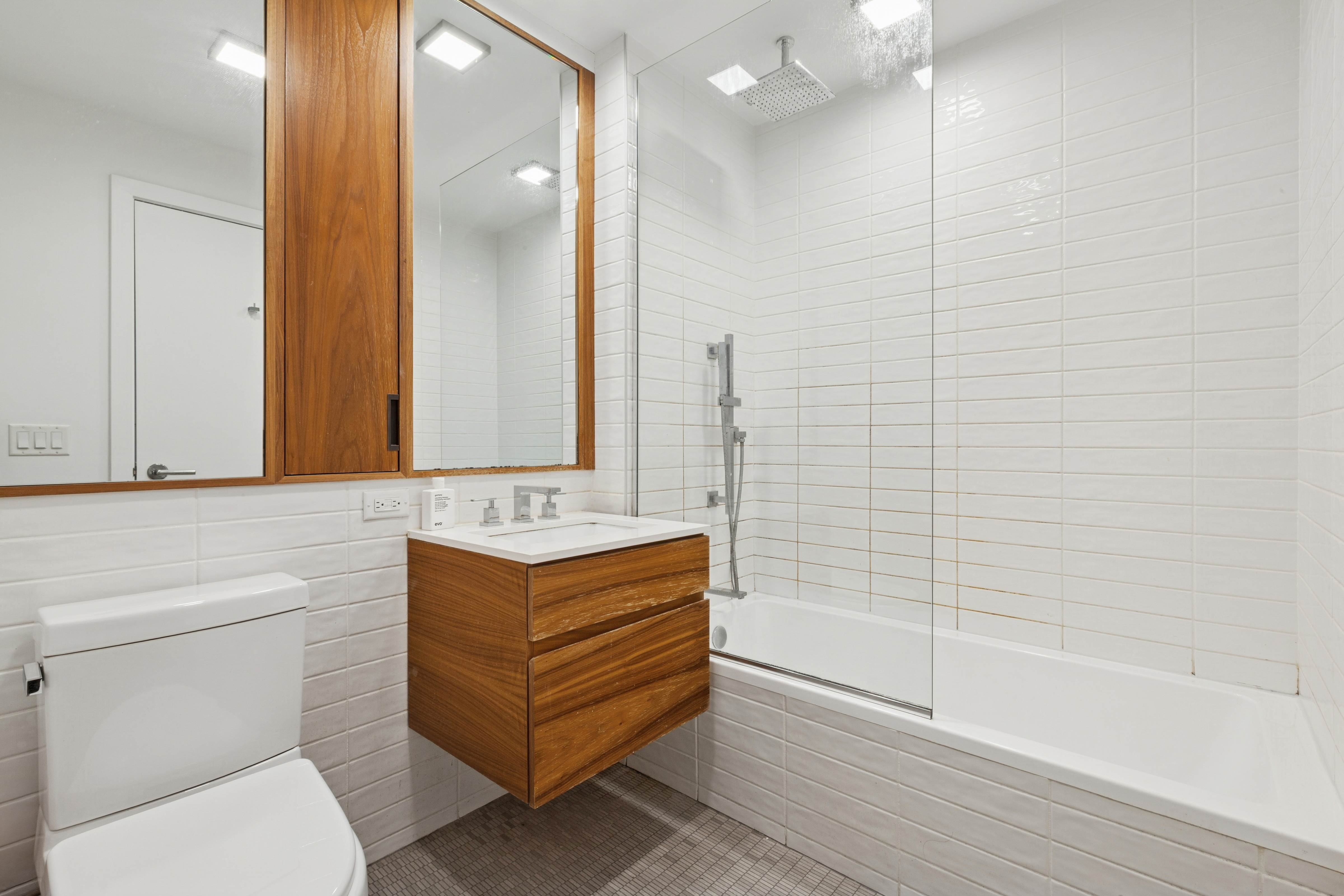 319 Schermerhorn Street, Unit 19B Brooklyn, NY 11217 - Photo 8 of 13 a bathroom with a sink a toilet and shower