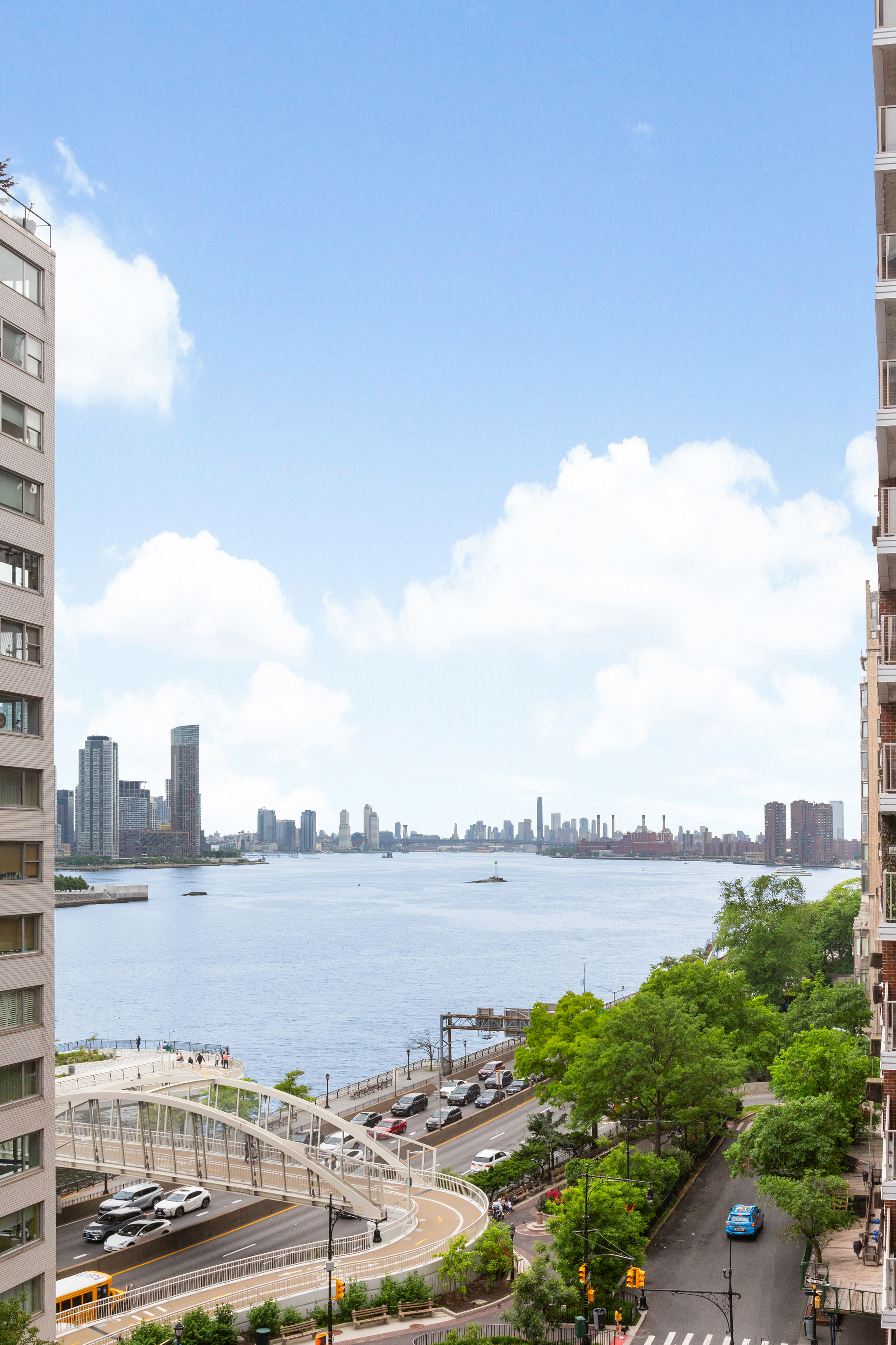 50 Sutton Place South, Unit 9F Manhattan, NY 10022 - Photo 9 of 10 a city view with a lake view