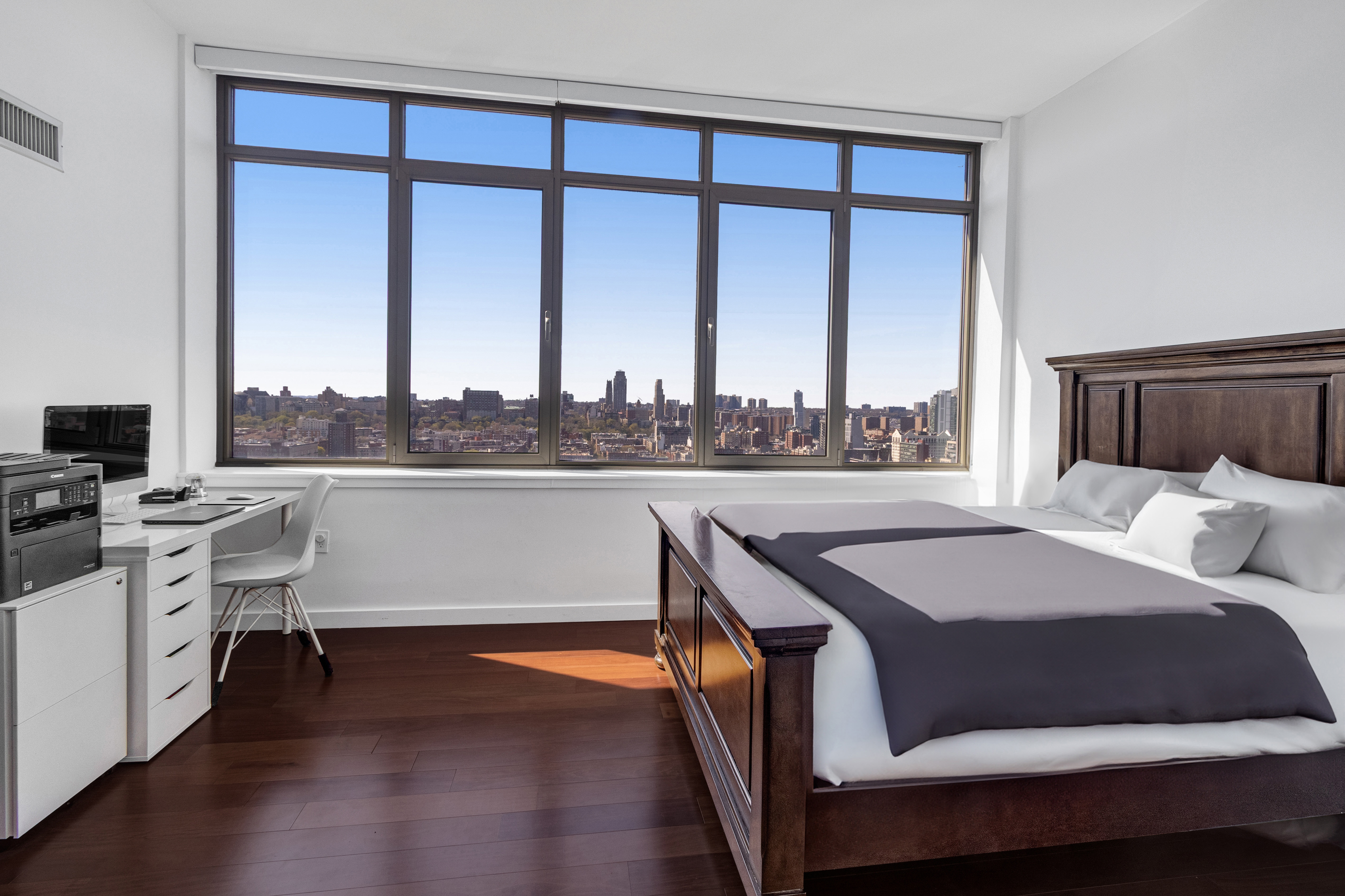 1485 5th Avenue, Unit 24F Manhattan, NY 10035 - Photo 5 of 16 a living room with furniture and a floor to ceiling window
