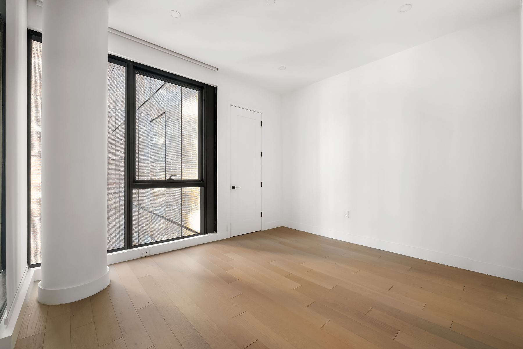 4507 Court Square, Unit 6A Queens, NY 11101 - Photo 12 of 19 a view of an empty room with a window