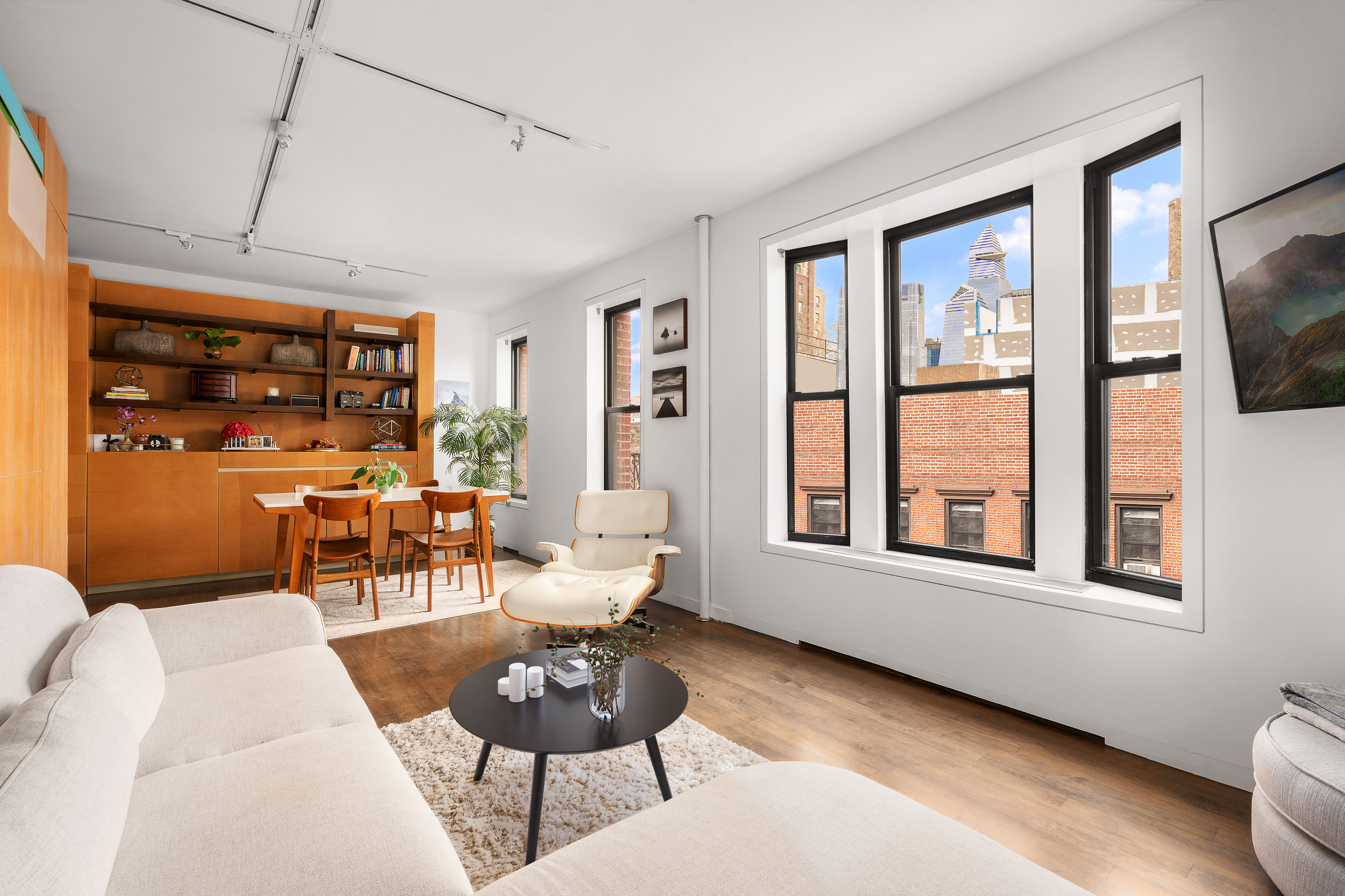 340 West 19th Street, Unit 14 Manhattan, NY 10011 - Photo 3 of 12 a living room with furniture and a window