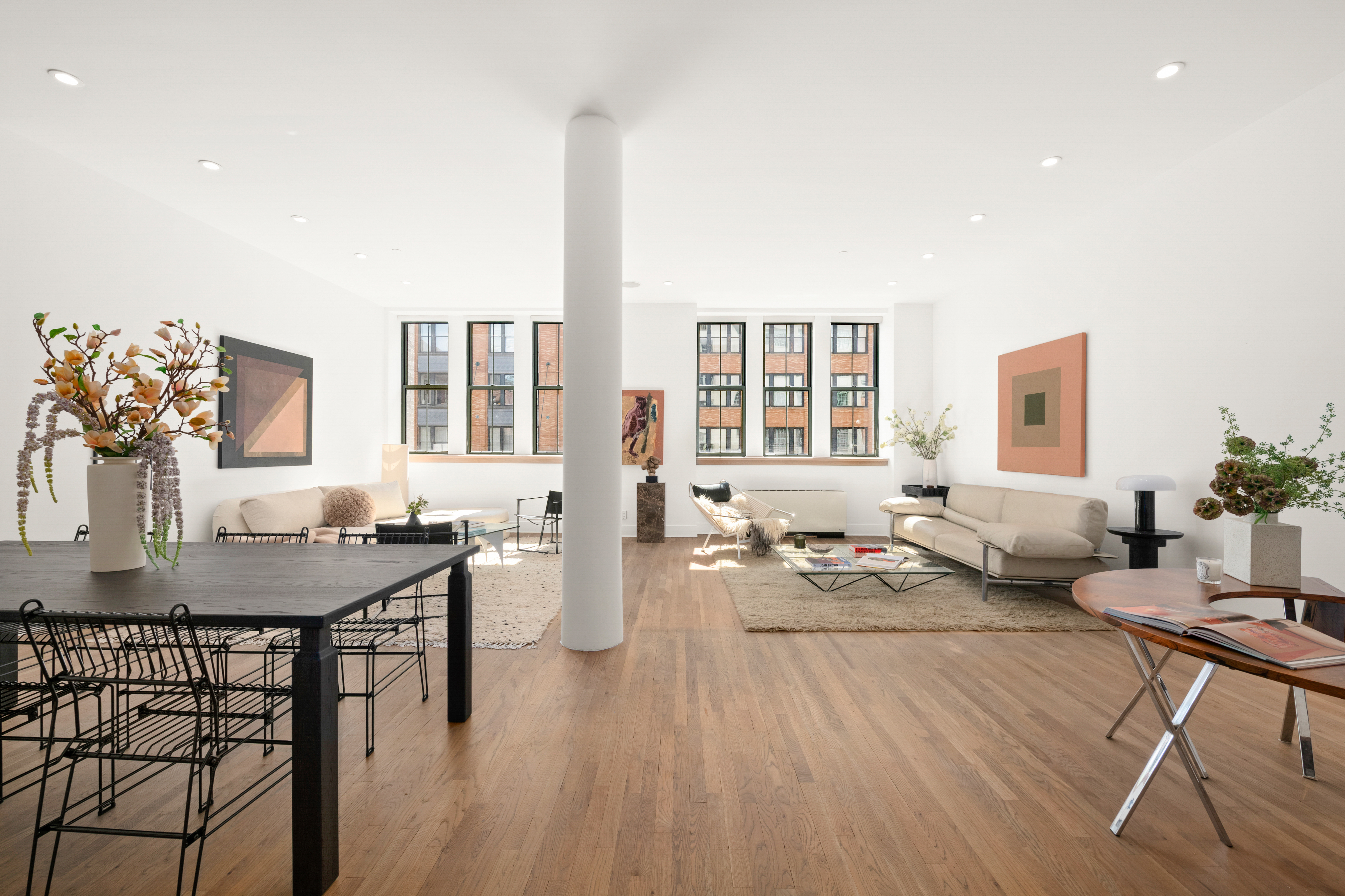 53 North Moore Street, Unit 2F East Manhattan, NY 10013 - Photo 2 of 12 a living room with furniture and wooden floor
