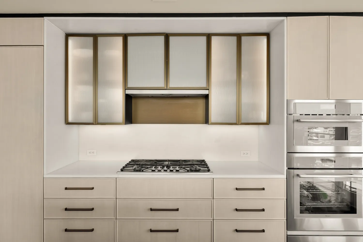 a kitchen with stainless steel appliances granite countertop a stove and a refrigerator